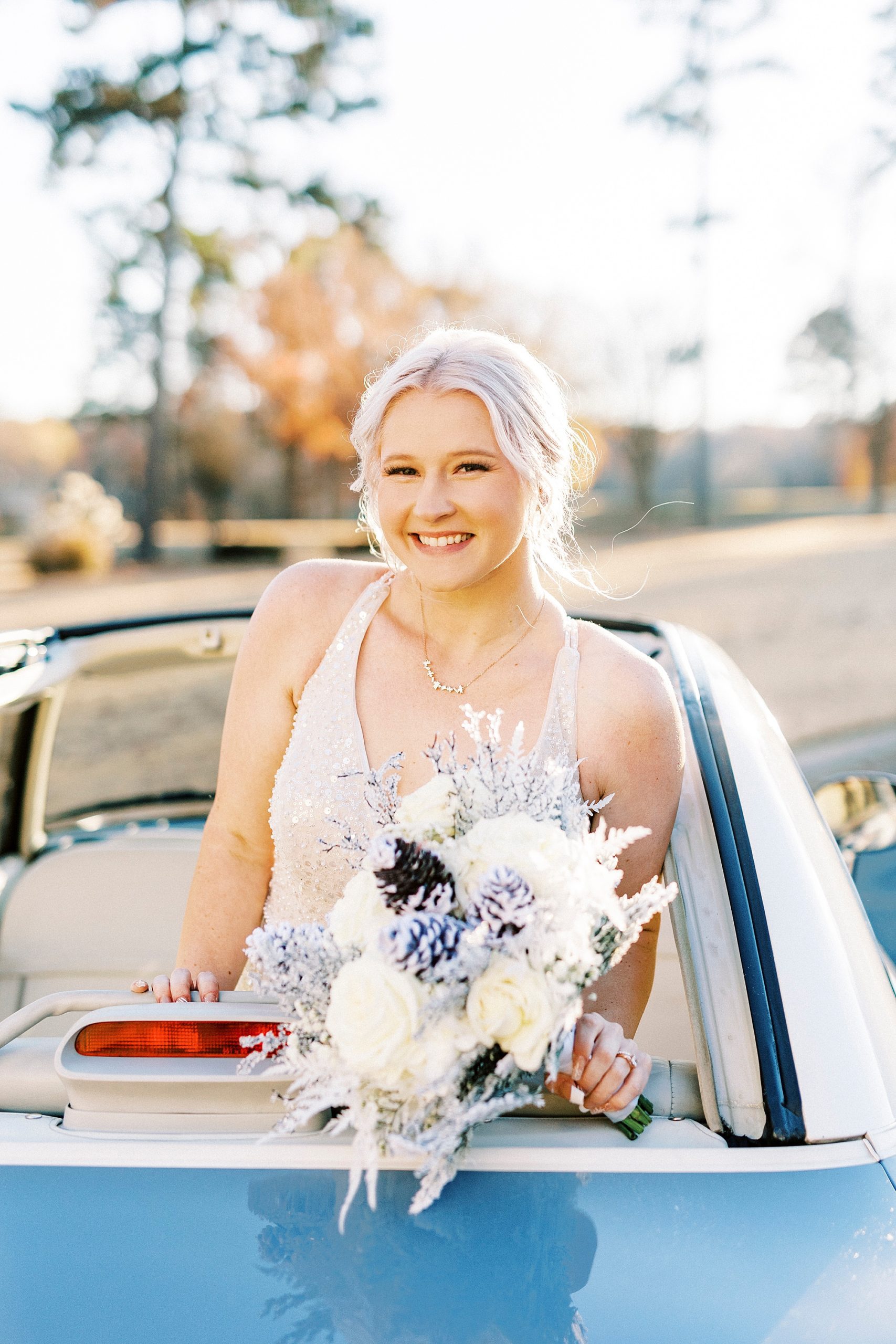 bride grins posing in the back of Charlotte the Figgy