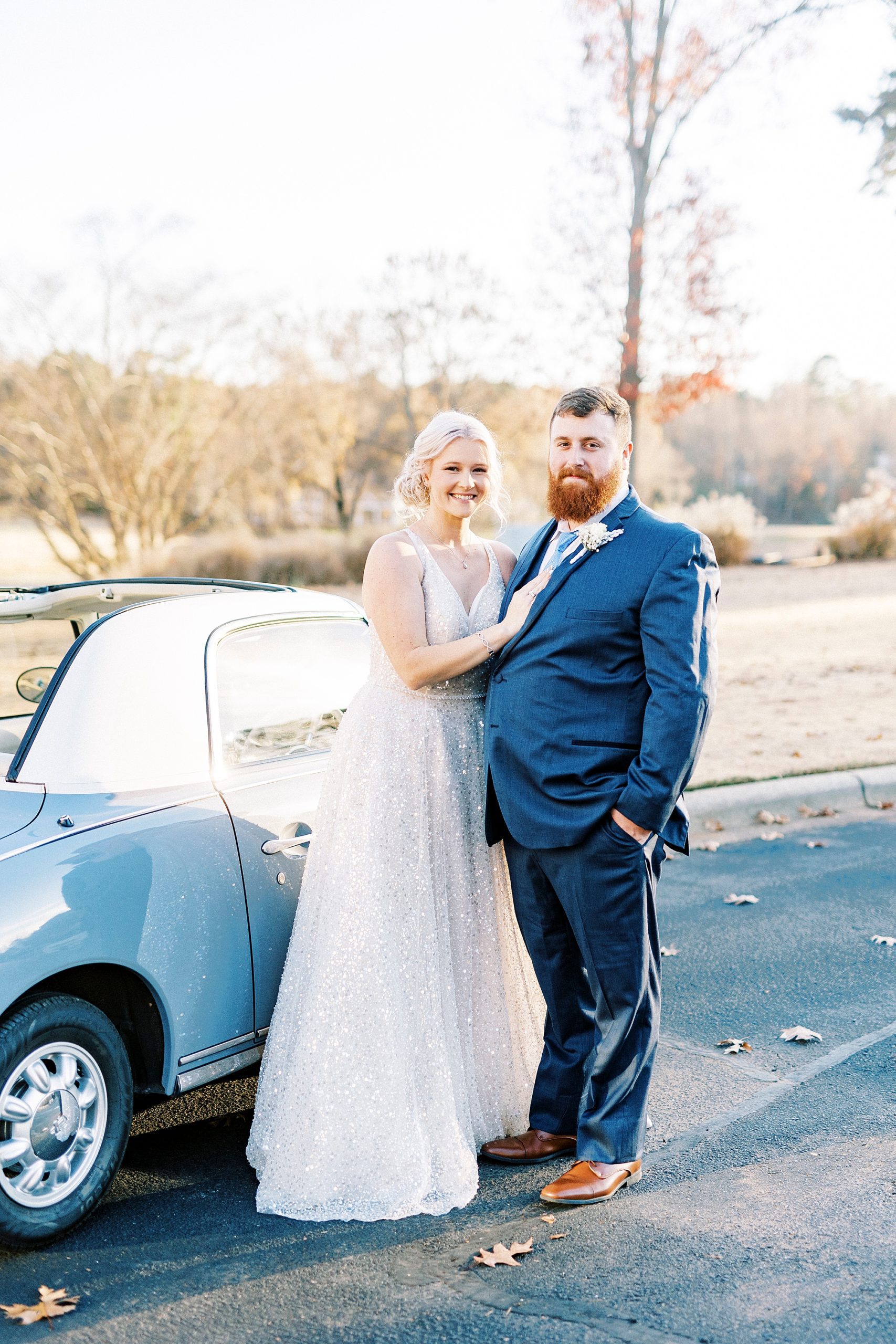 bride and groom pose near Charlotte the Figgy