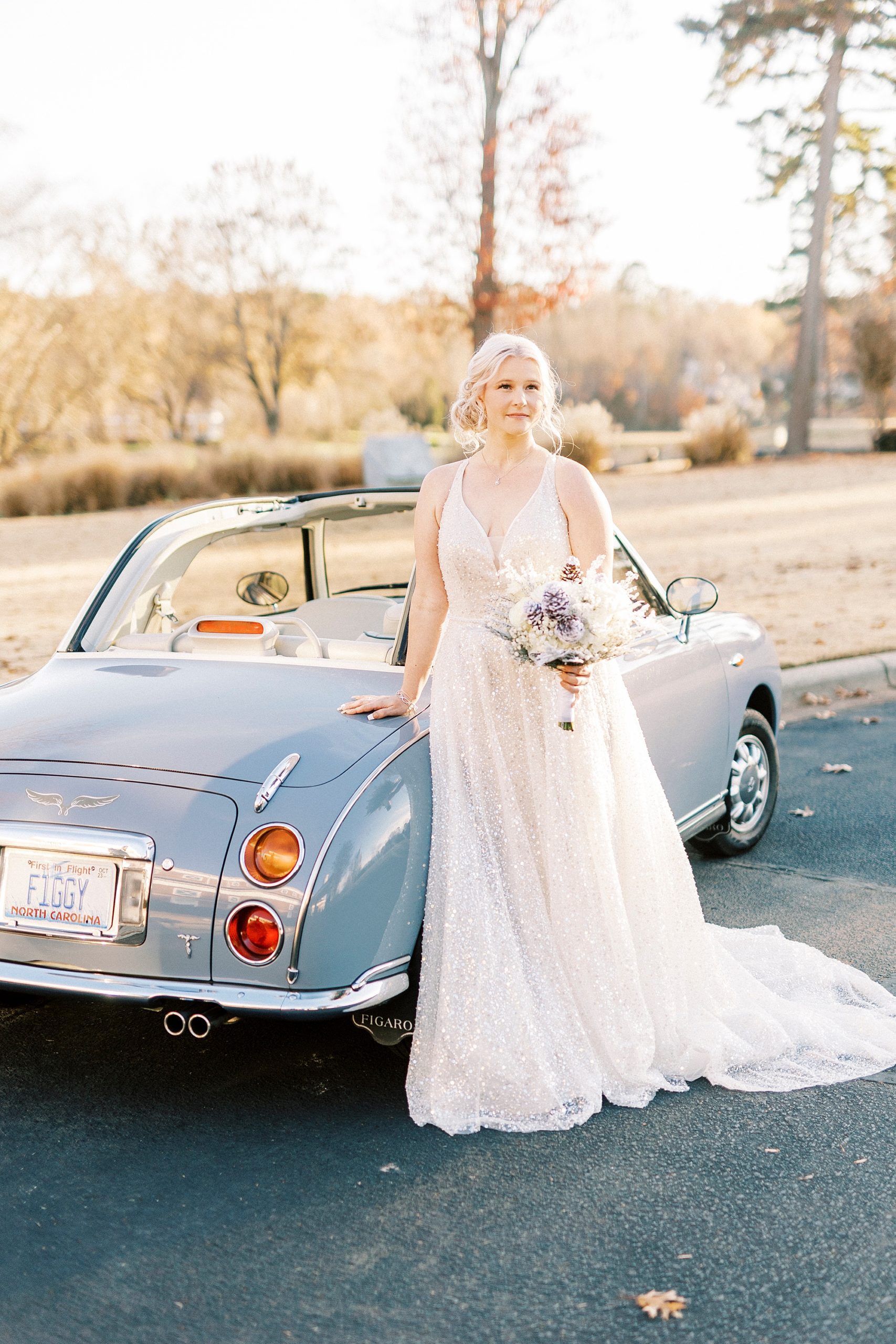 bride leans against Charlotte the Figgy during winter wedding day