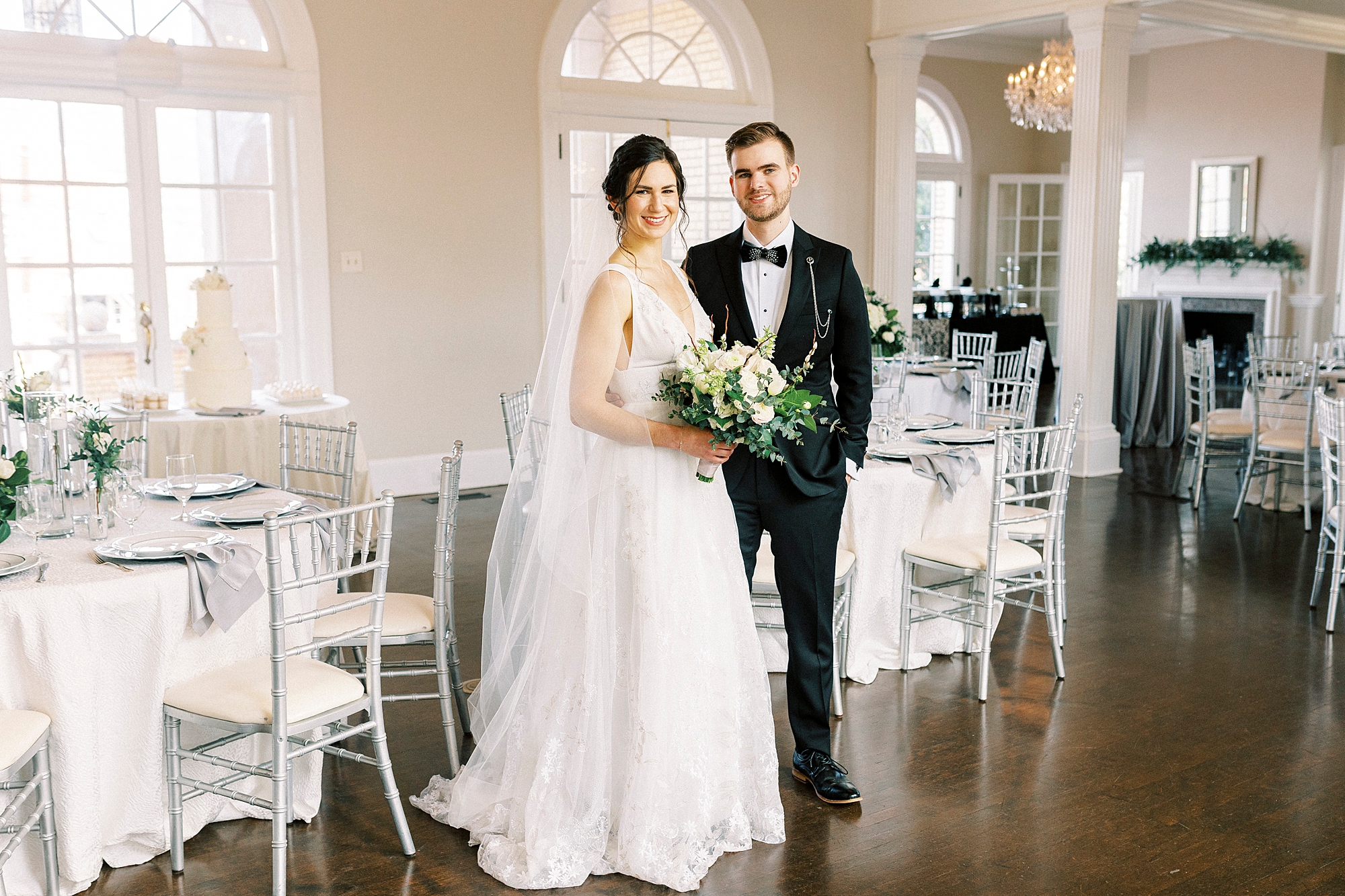 bride and groom pose in reception hall at the Separk Mansion