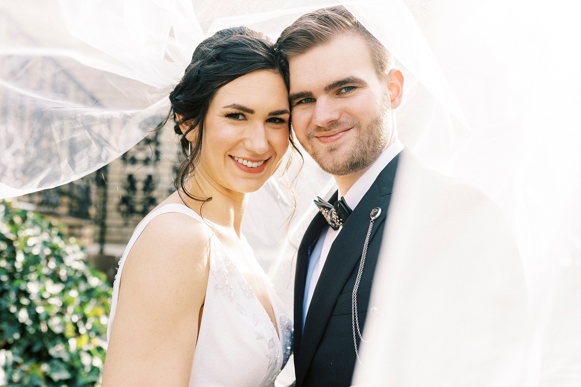 bride and groom lean heads together under bride's veil at Separk Mansion