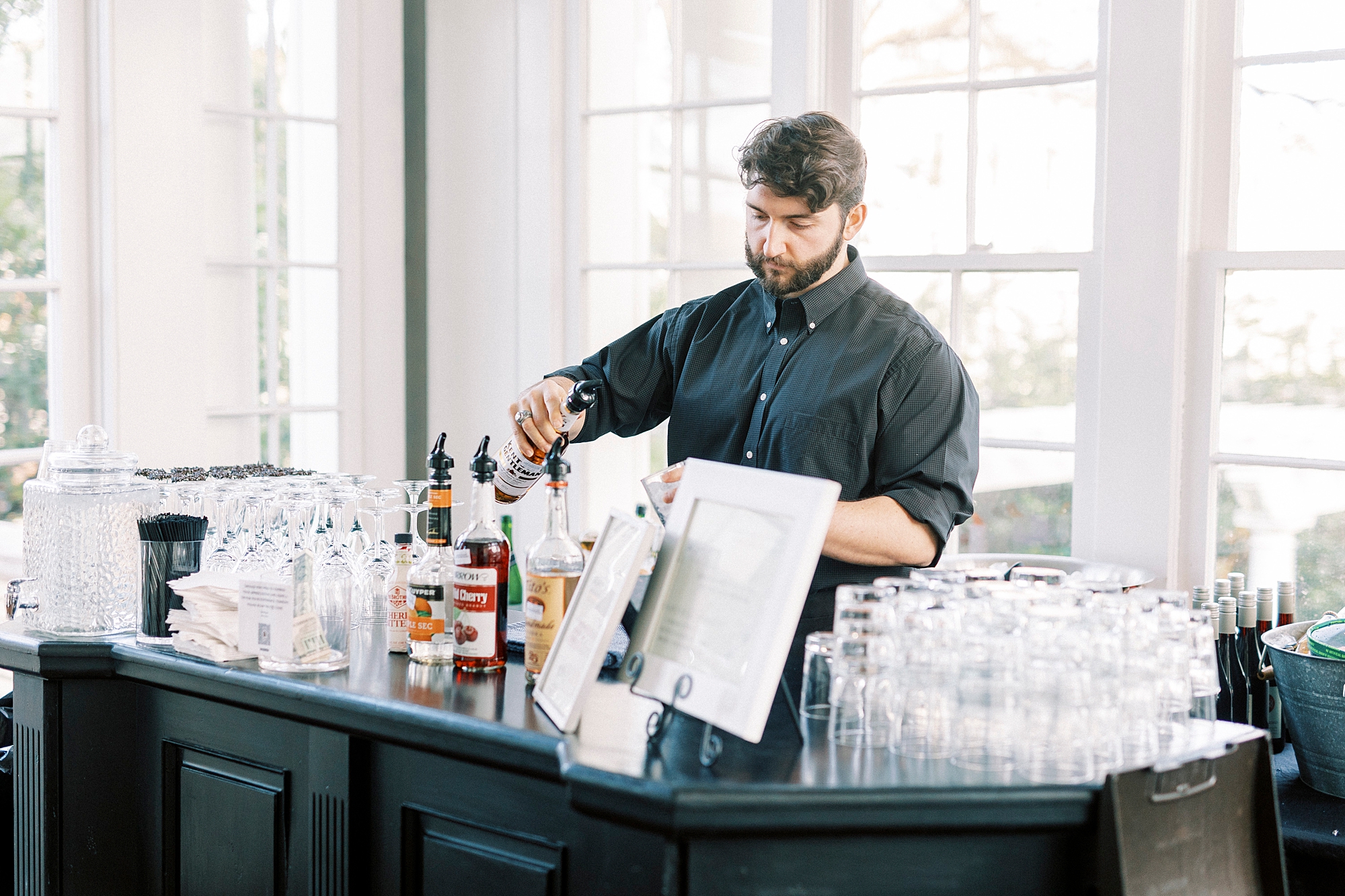 bartender makes drinks during tasting event 