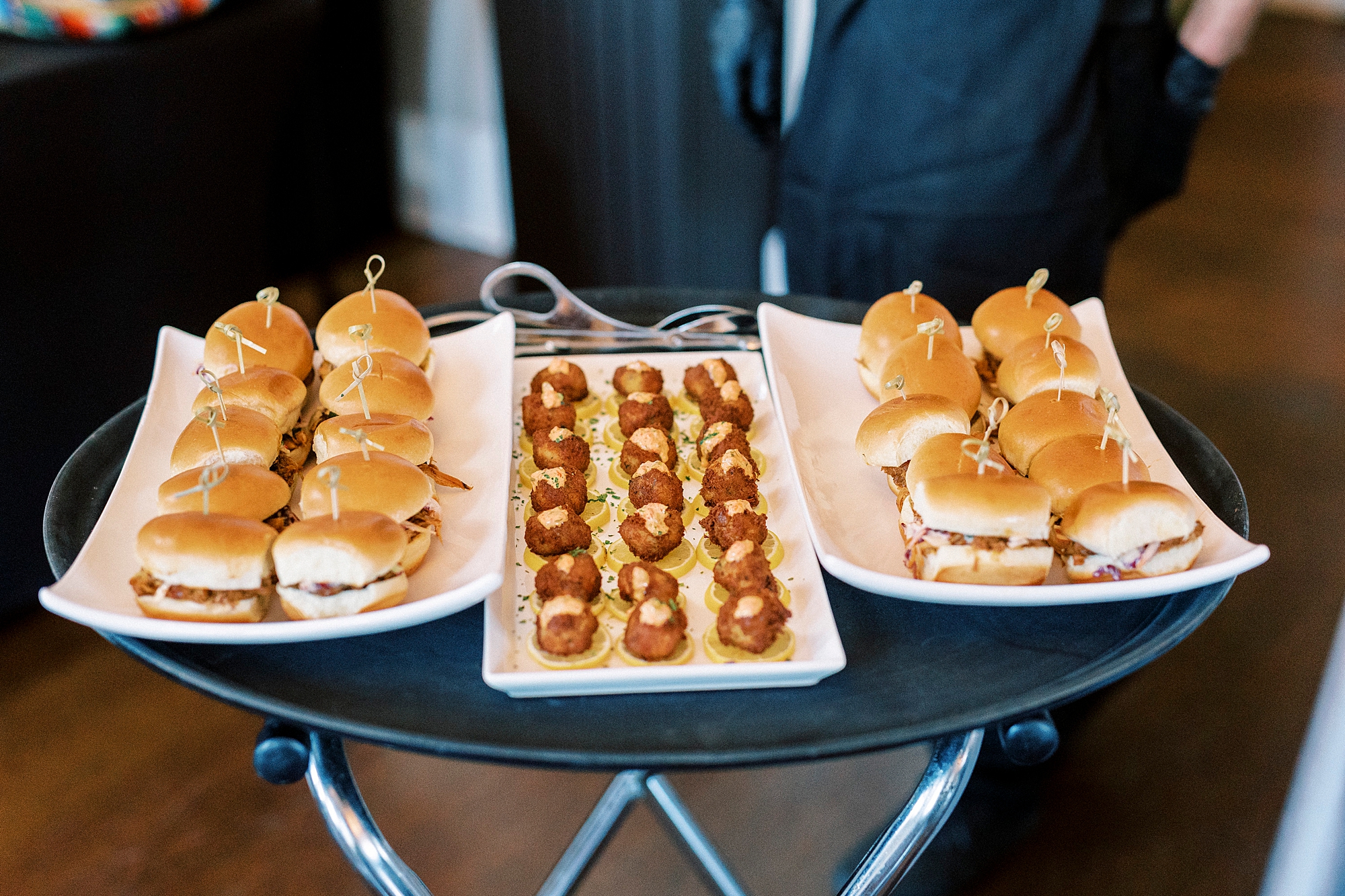 caterers hold tray of food for Grand Tasting Event at Separk Mansion in winter 2023 