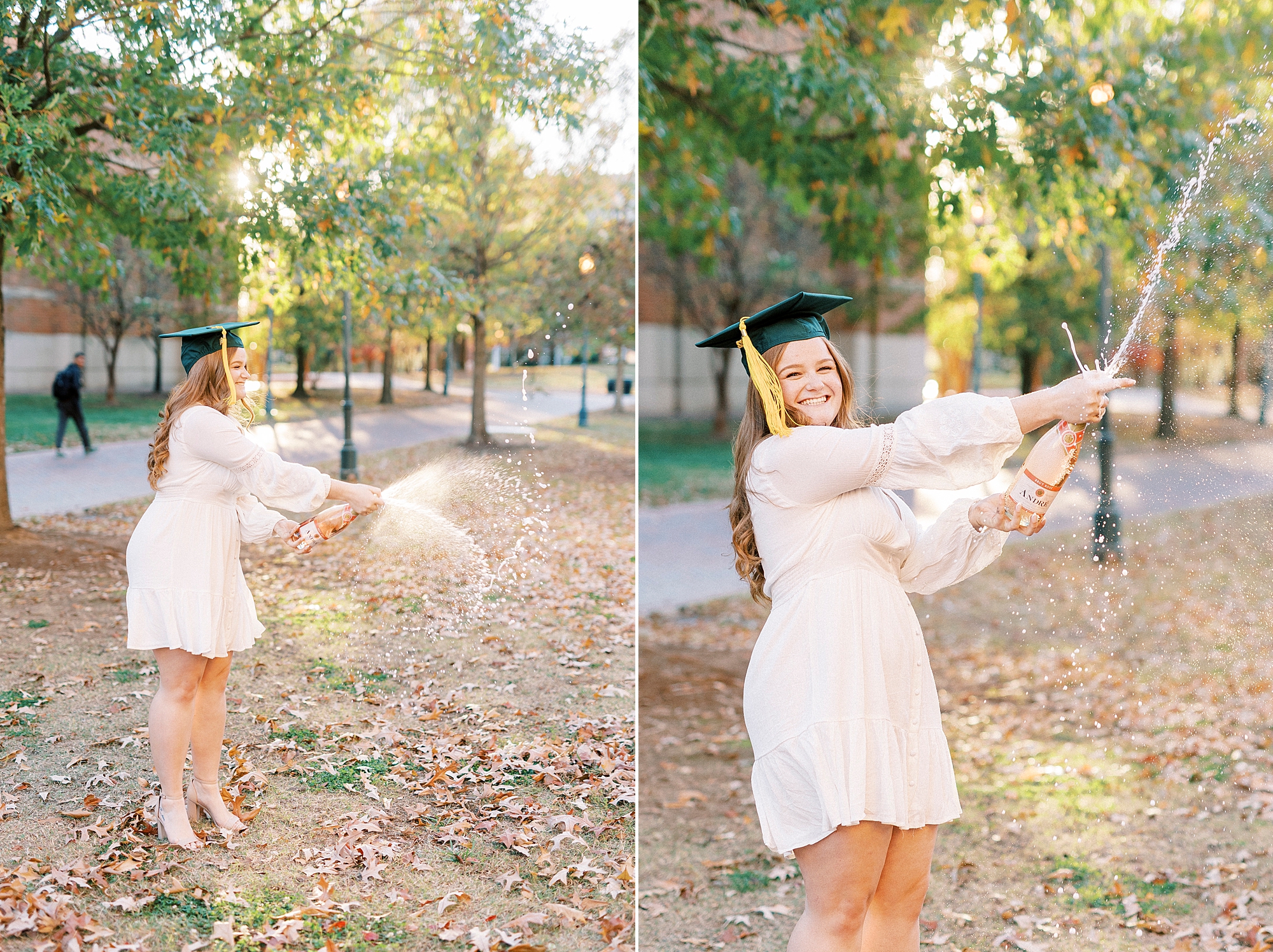 graduate in white dress with green cap pops champagne on lawn at UNC Charlotte