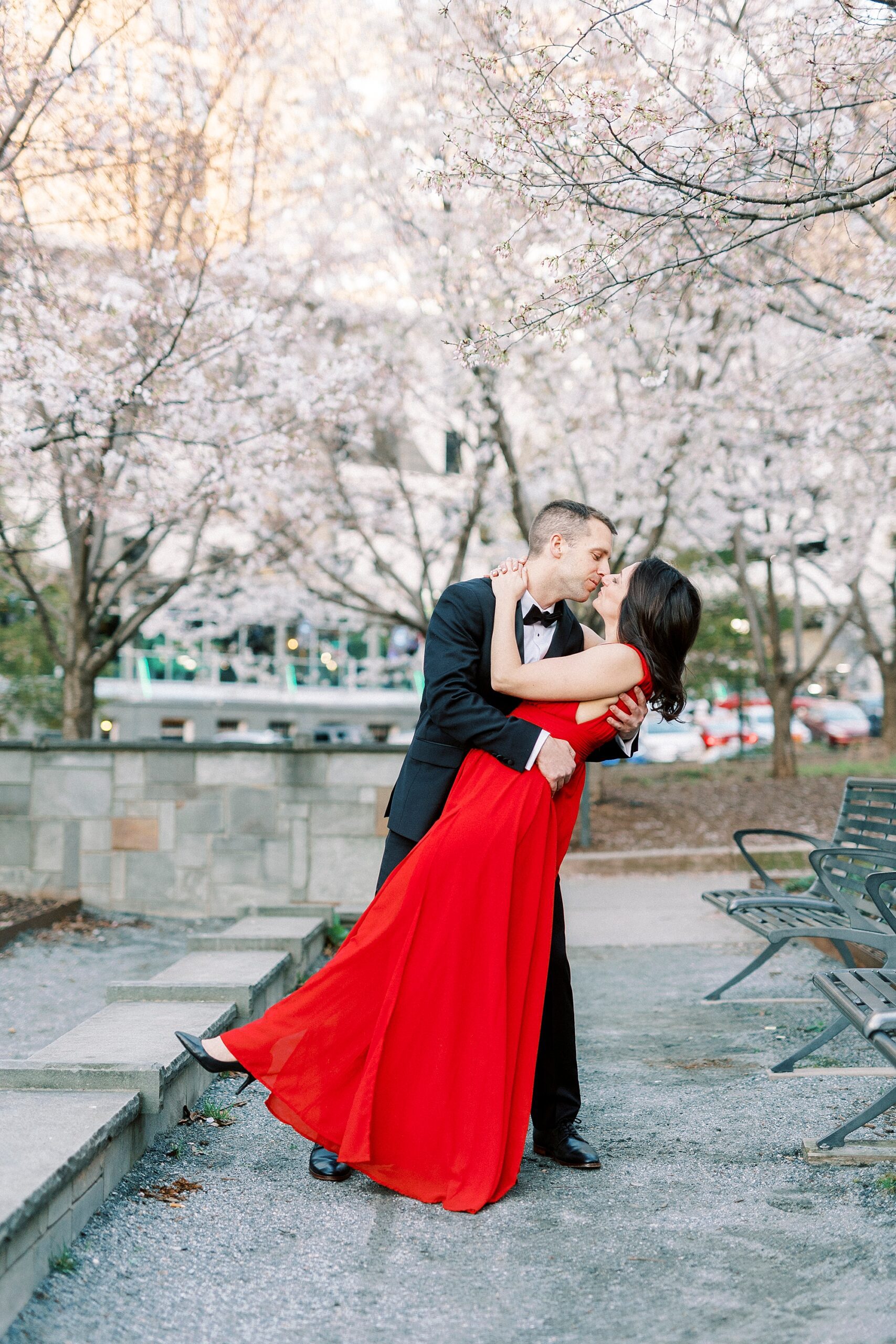 man kisses woman dipping her at Romare Bearden Park