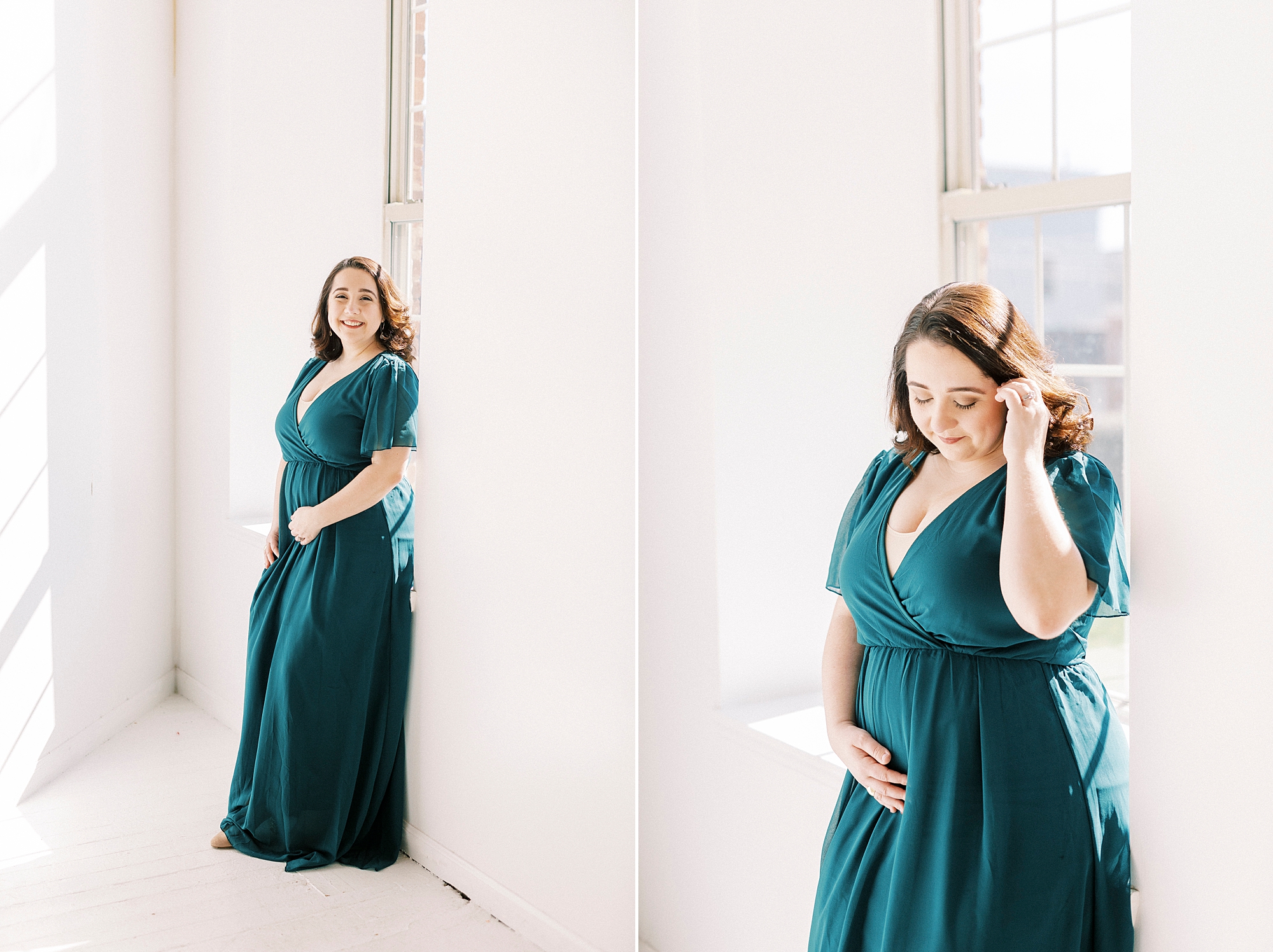 woman in teal gown holds baby bump in Concord NC studio