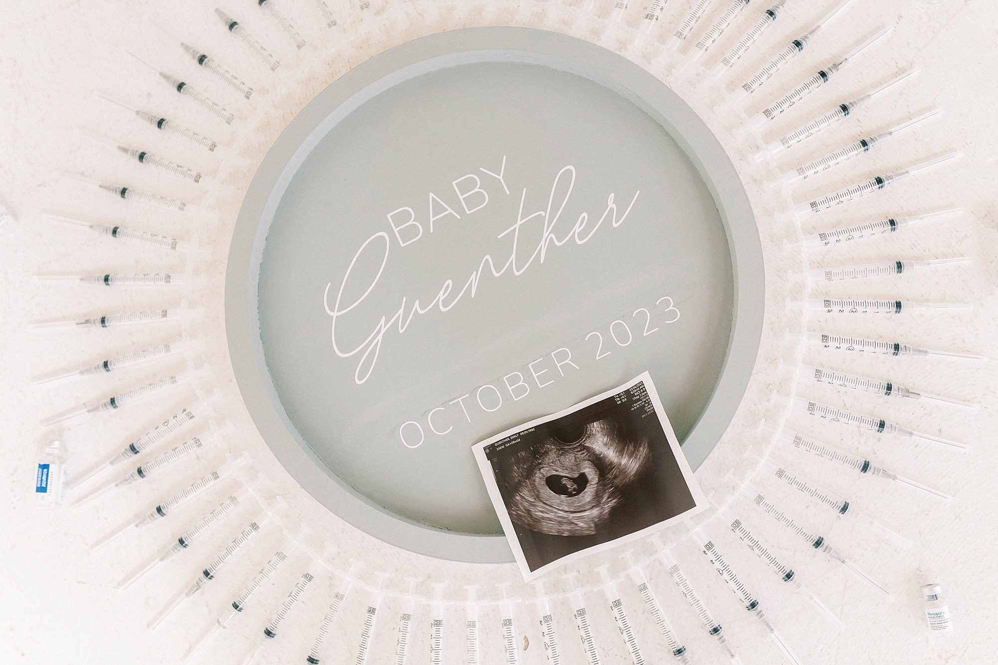 announcement sign with IVF needles