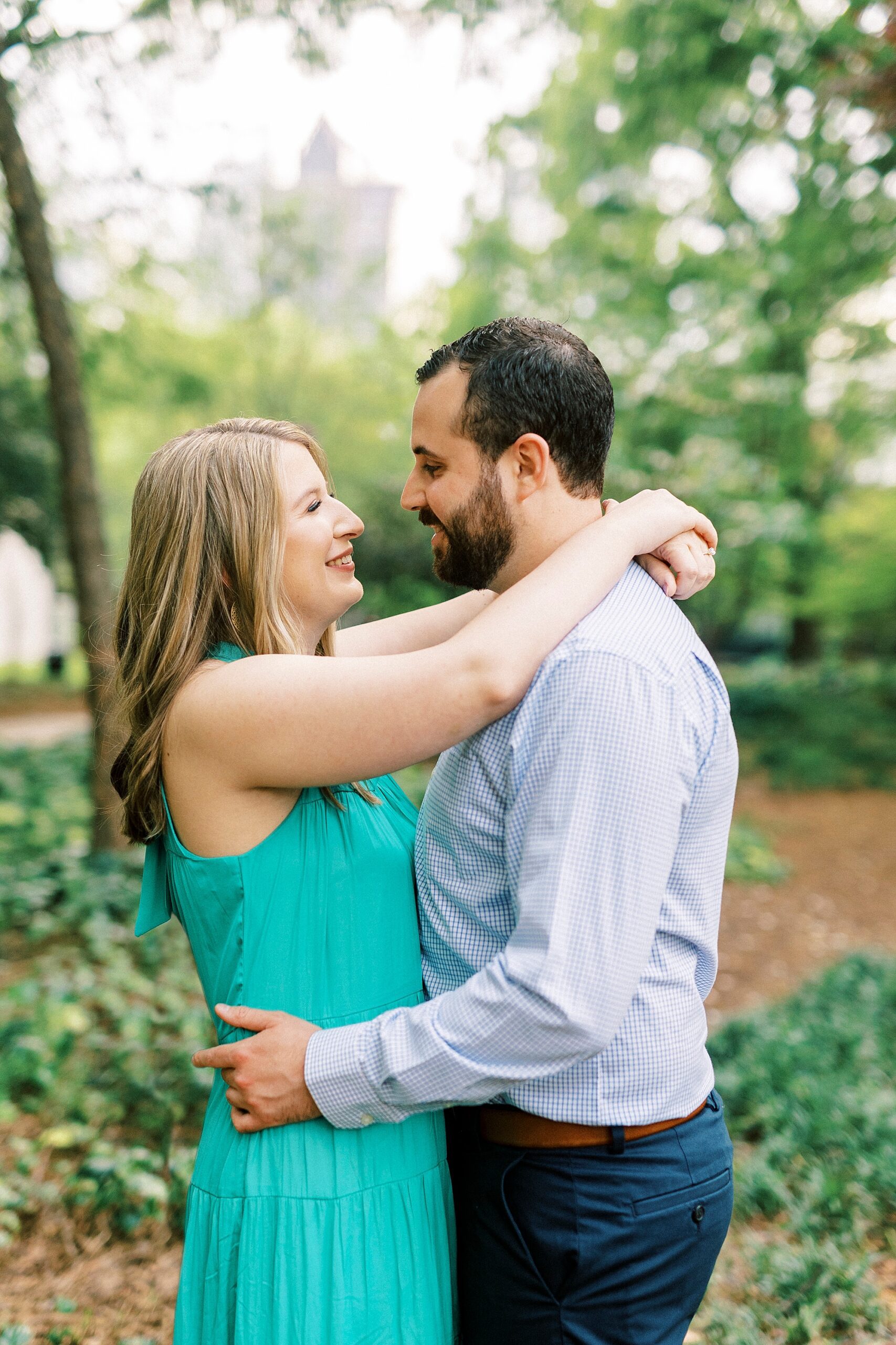 bride and groom hug in garden at Fourth Ward Park