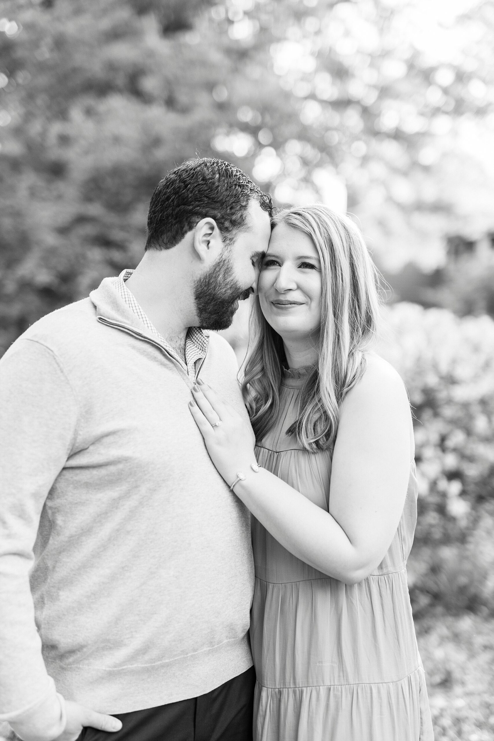 bride and groom hug leaning heads together 