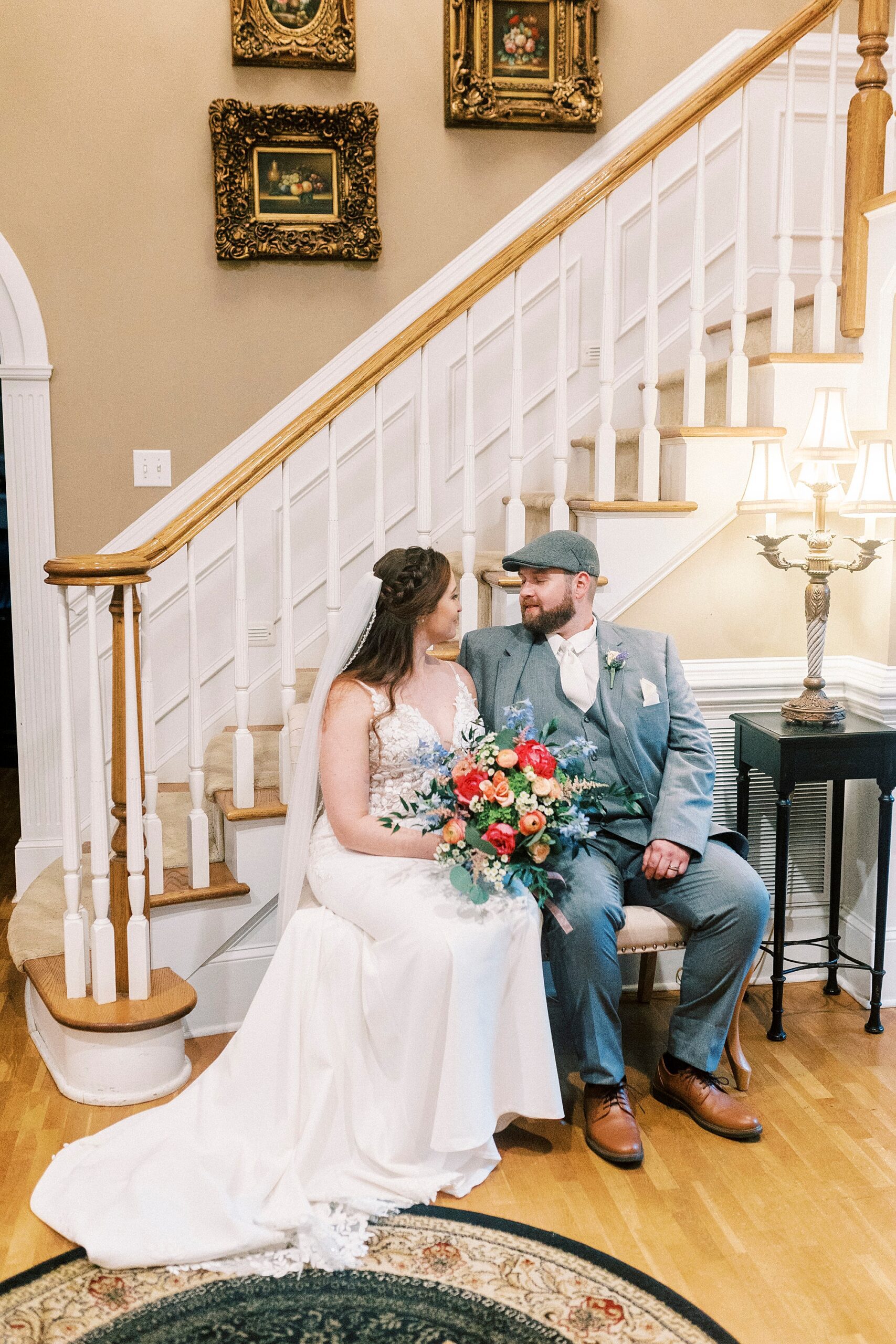bride and groom sit on bench at The Saratoga Springs