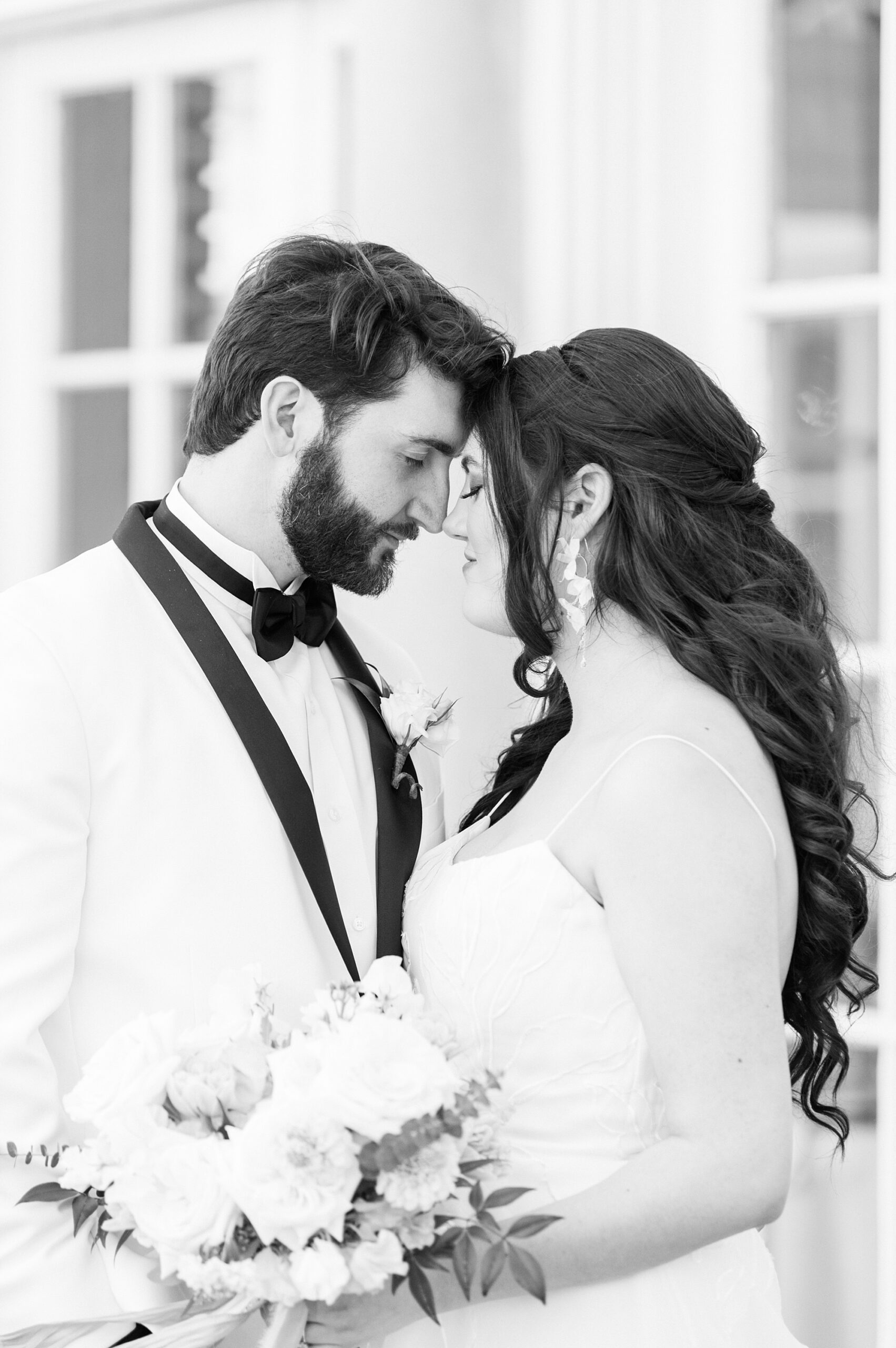 bride and groom lean heads together inside Separk Mansion