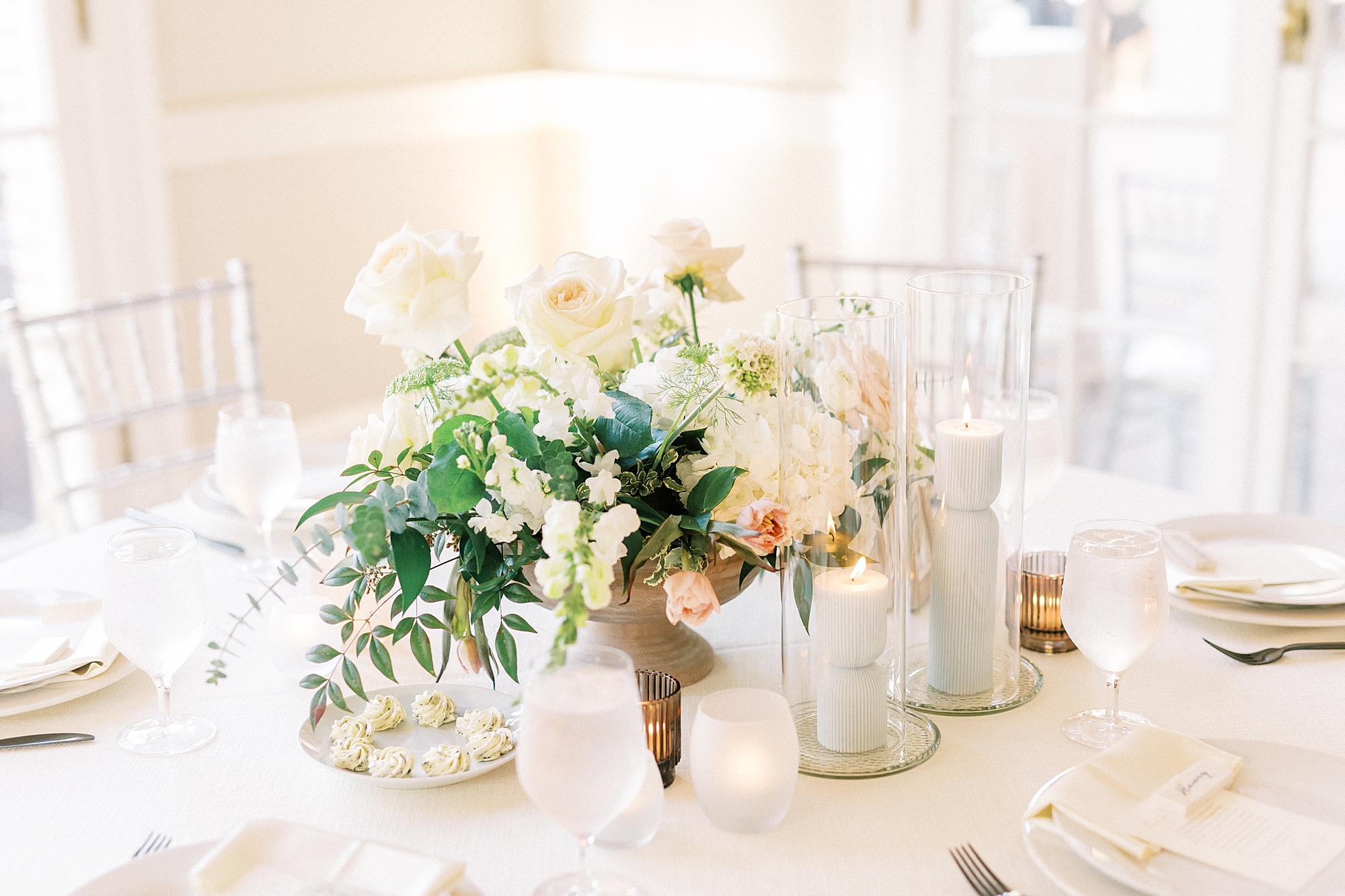 wedding reception centerpieces with pink and ivory flowers 