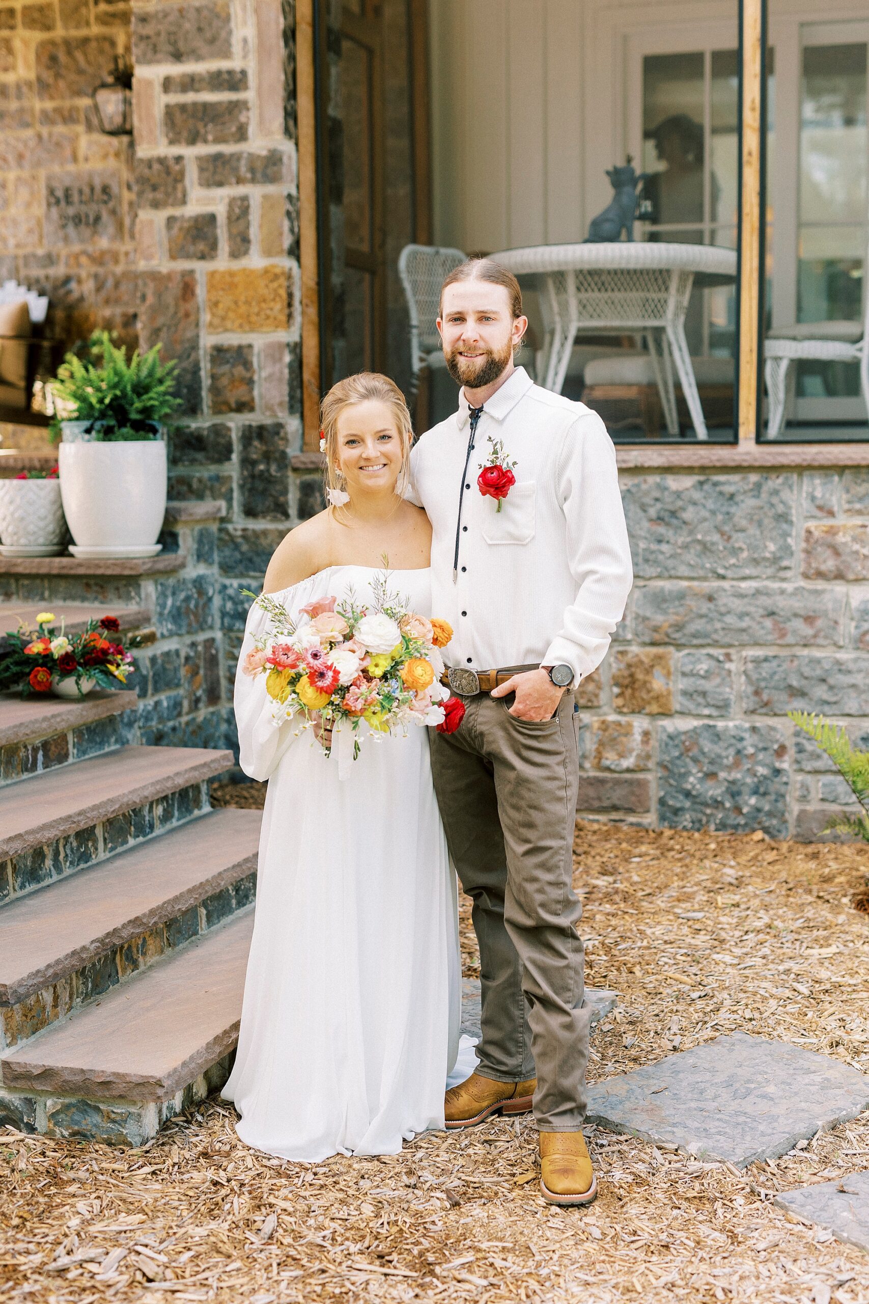 newlyweds hug outside of home in Richfield NC