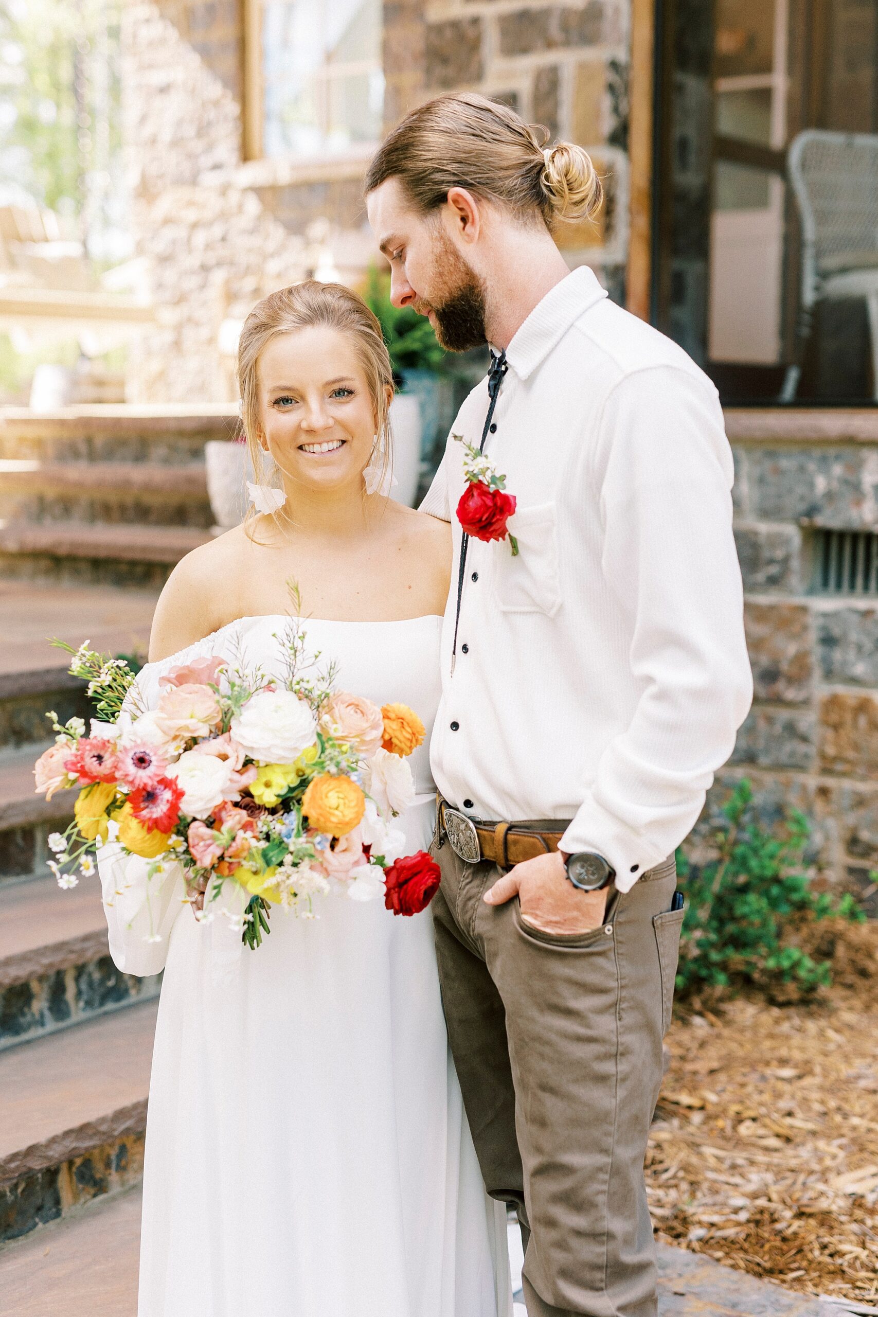 groom looks down at bride in front of home in Richfield NC