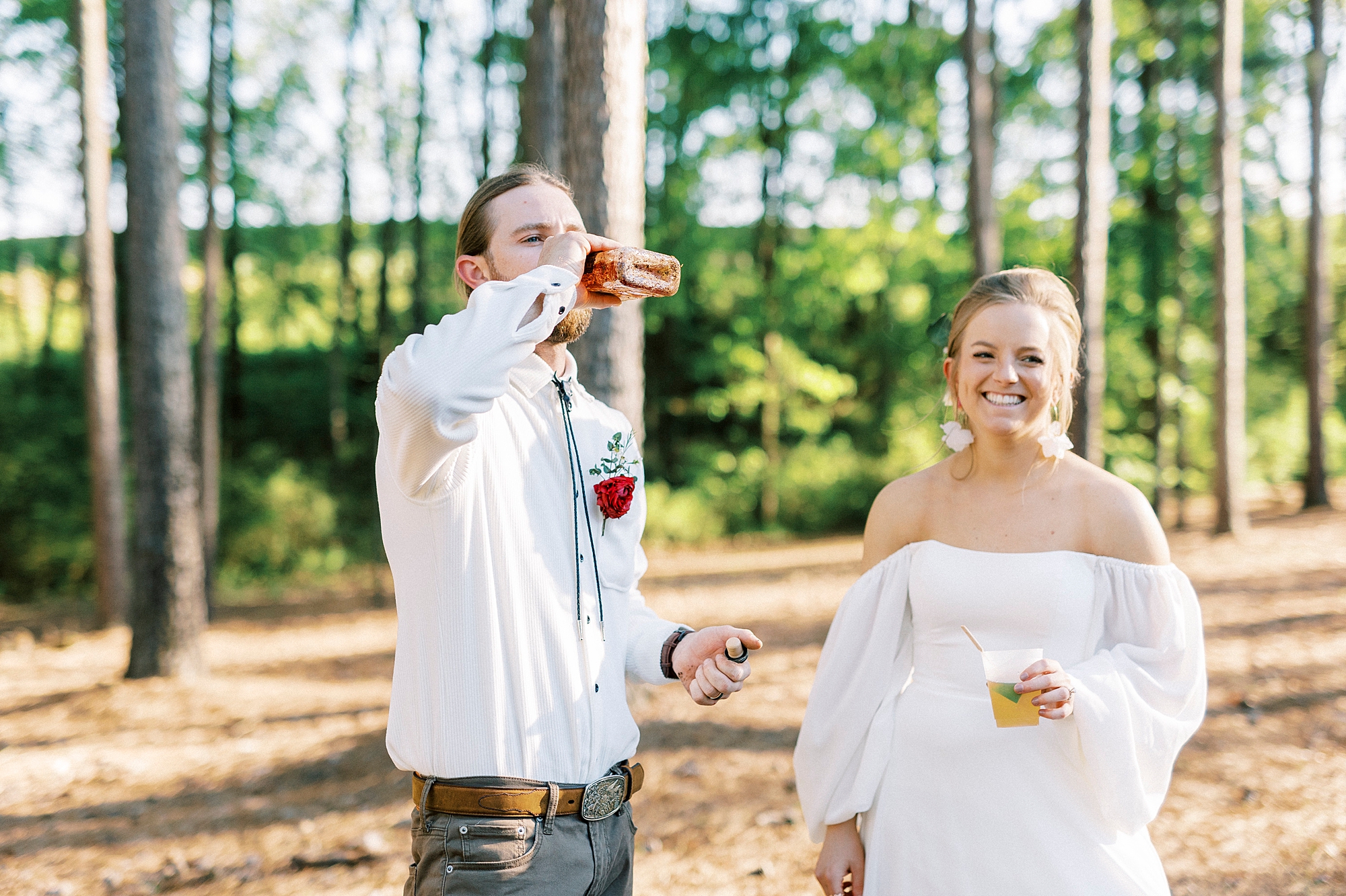 groom drinks bourbon on wedding day