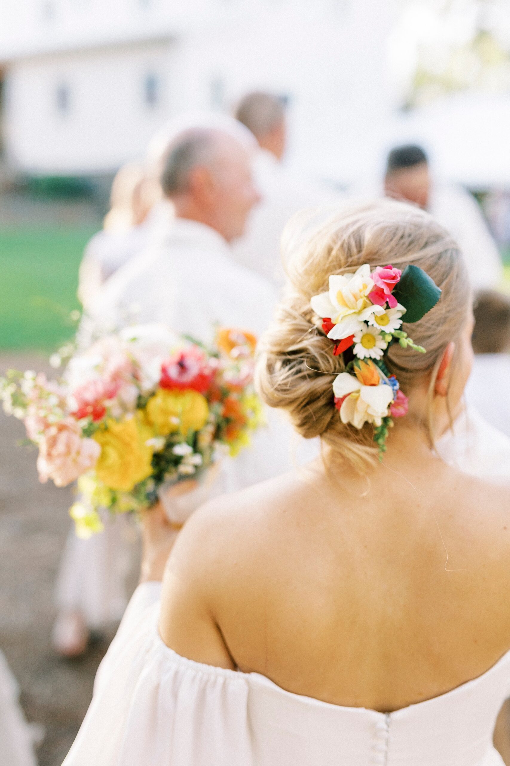 bride's white and red floral hairpiece 