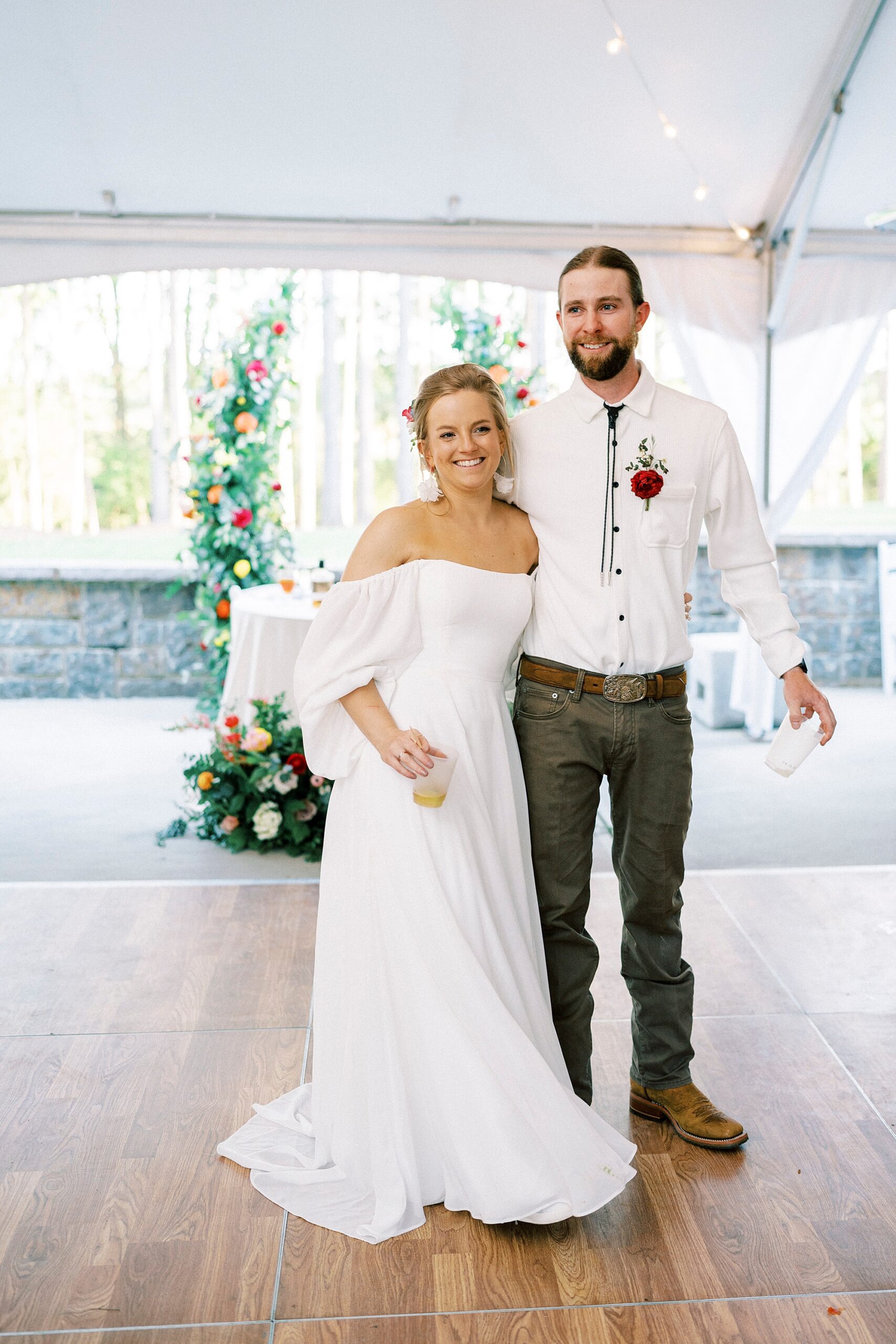 bride and from hug together on dance floor at wedding reception on lawn in Richfield NC