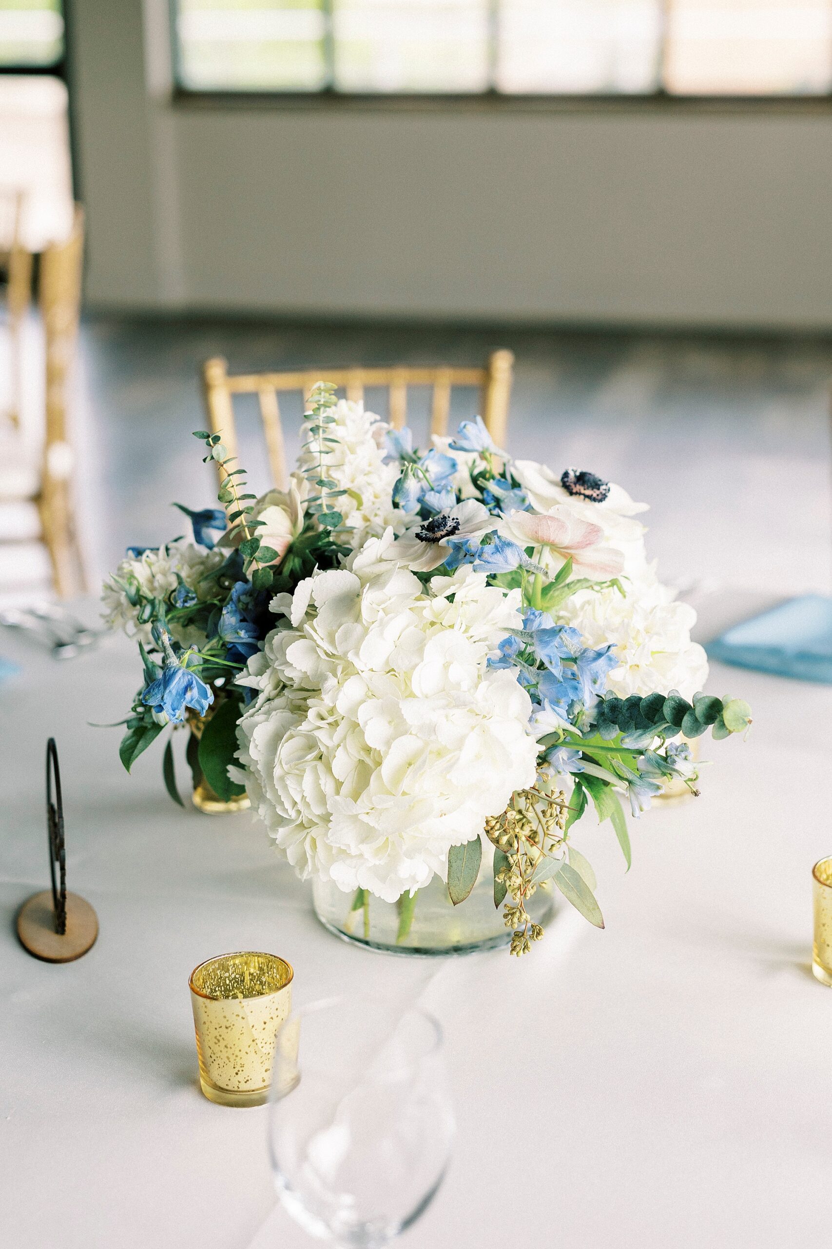 centerpiece of blue and white flowers at the Terrace at Cedar Hill