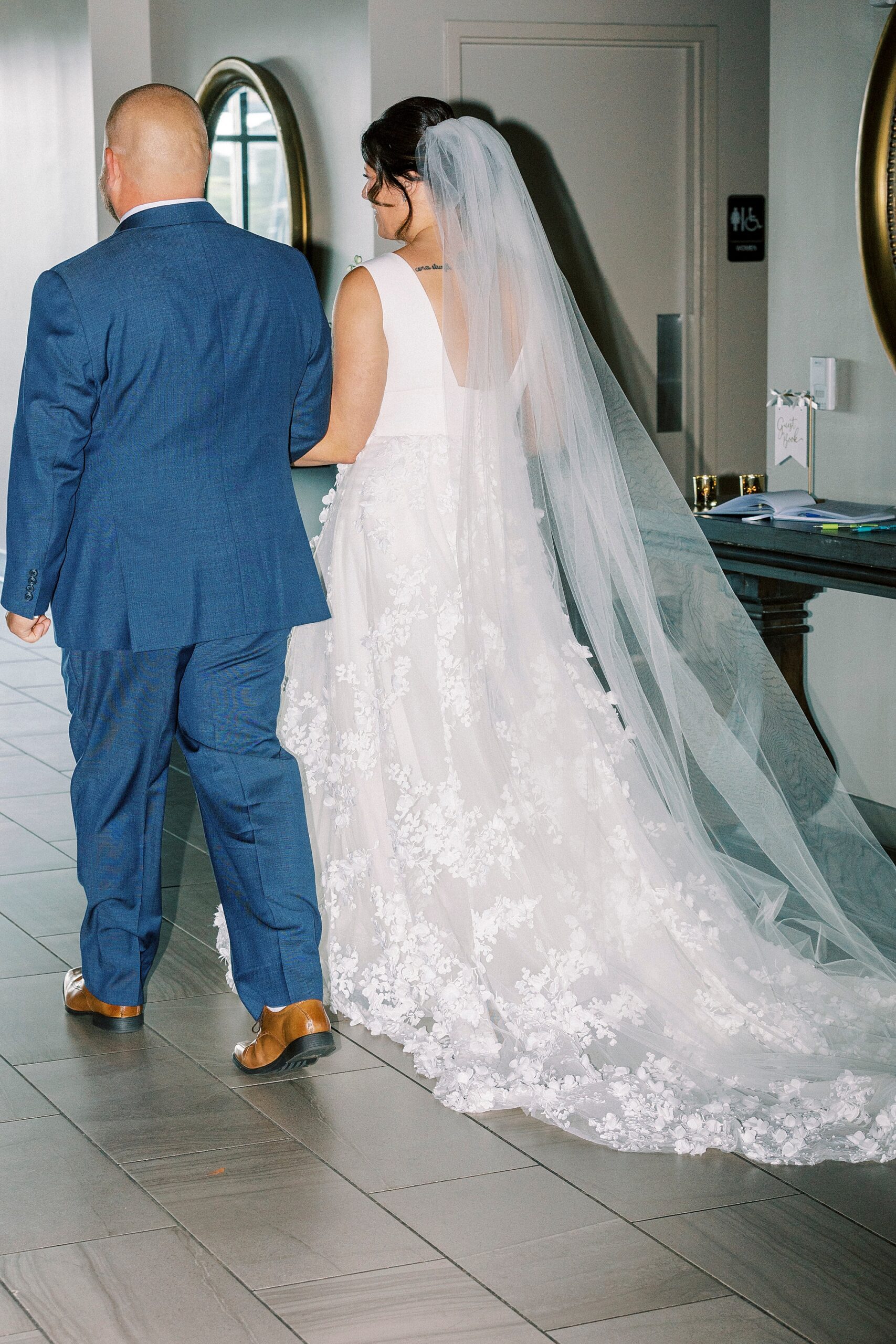 newlyweds hold hands walking away from ceremony at the Terrace at Cedar Hill
