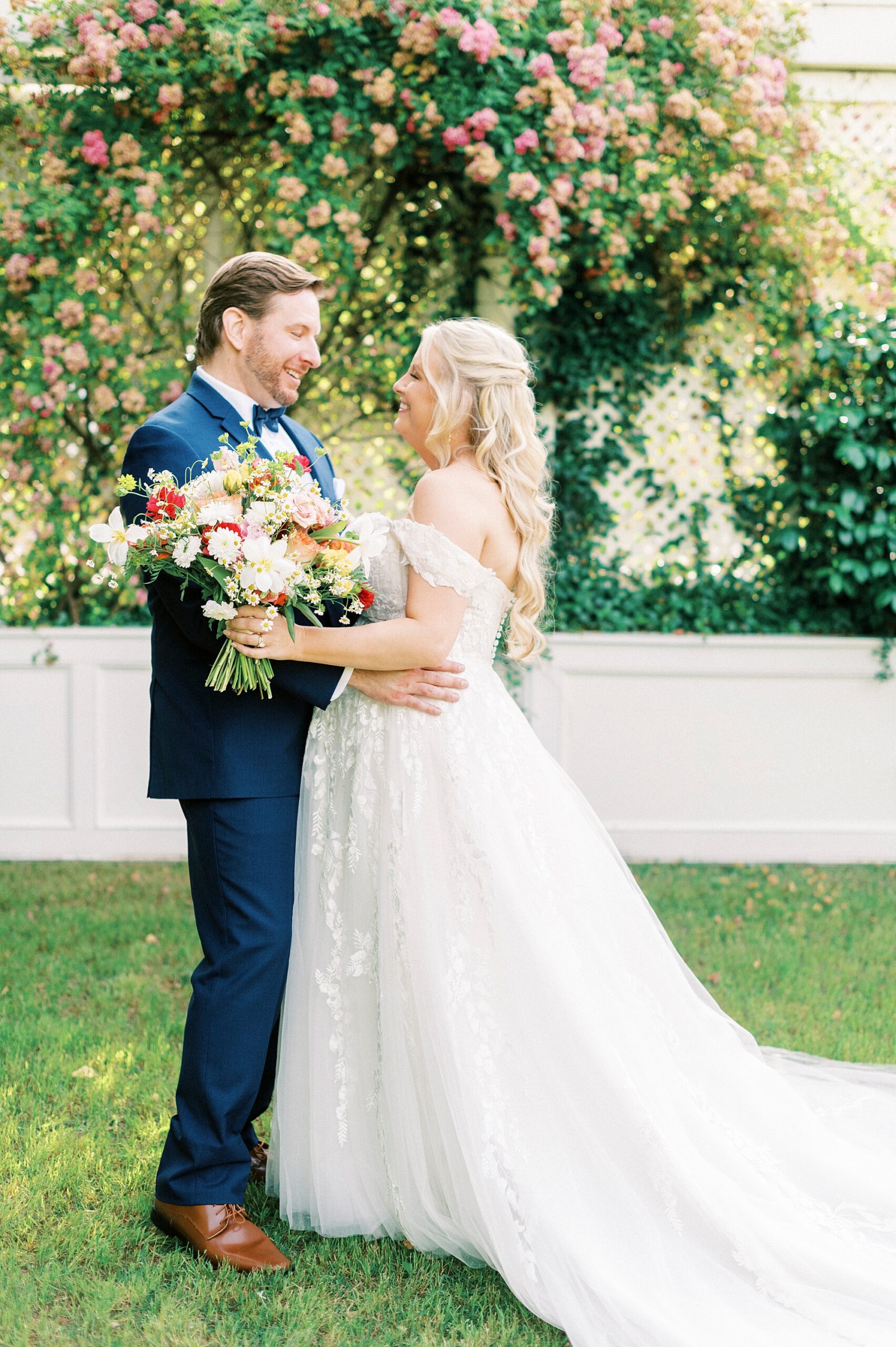 bride and groom hug during spring wedding at Separk Mansion