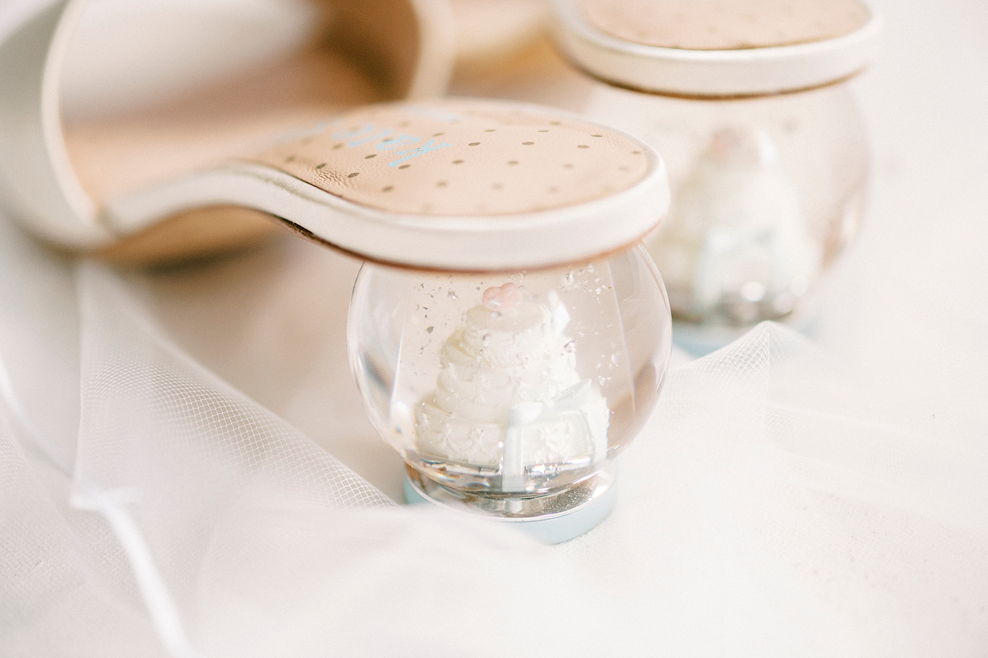 bride's shoes with snow globes as heels 