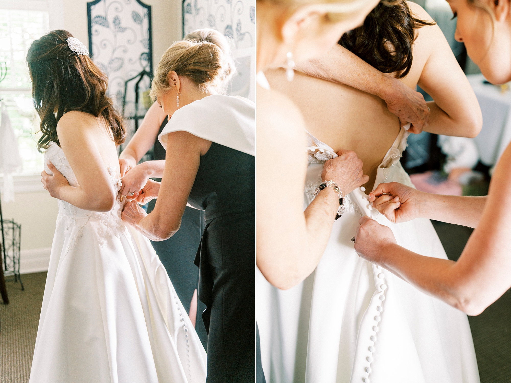 bridesmaids help bride into wedding dress