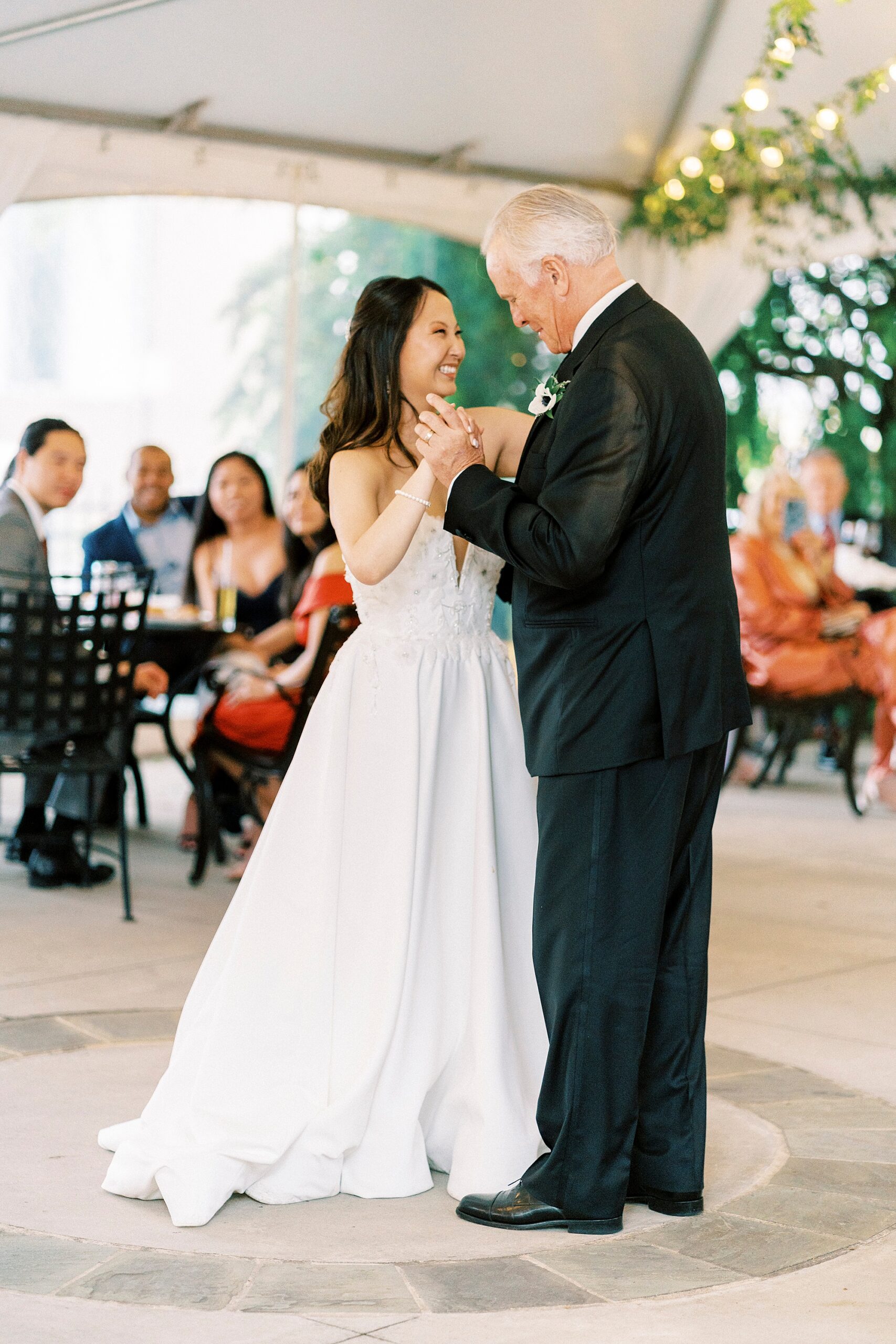 bride and father have dance under tent during The Spring House wedding reception 