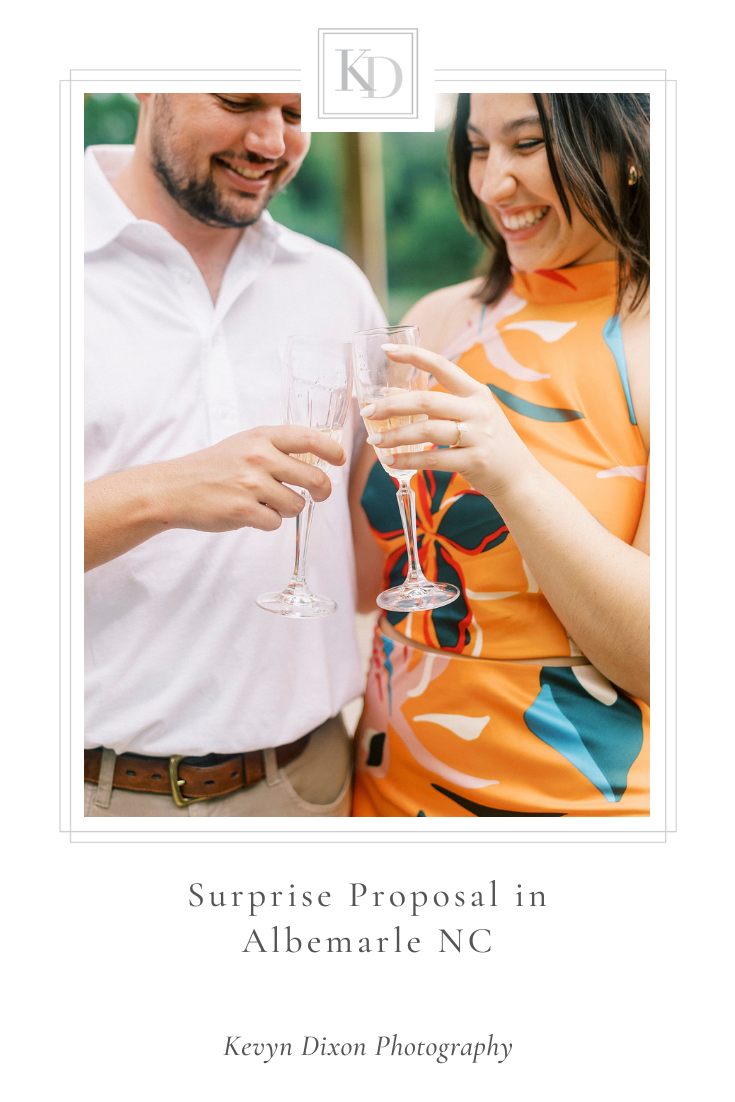 Surprise proposal along lake in Albemarle, NC photographed by North Carolina wedding photographer Kevyn Dixon Photography