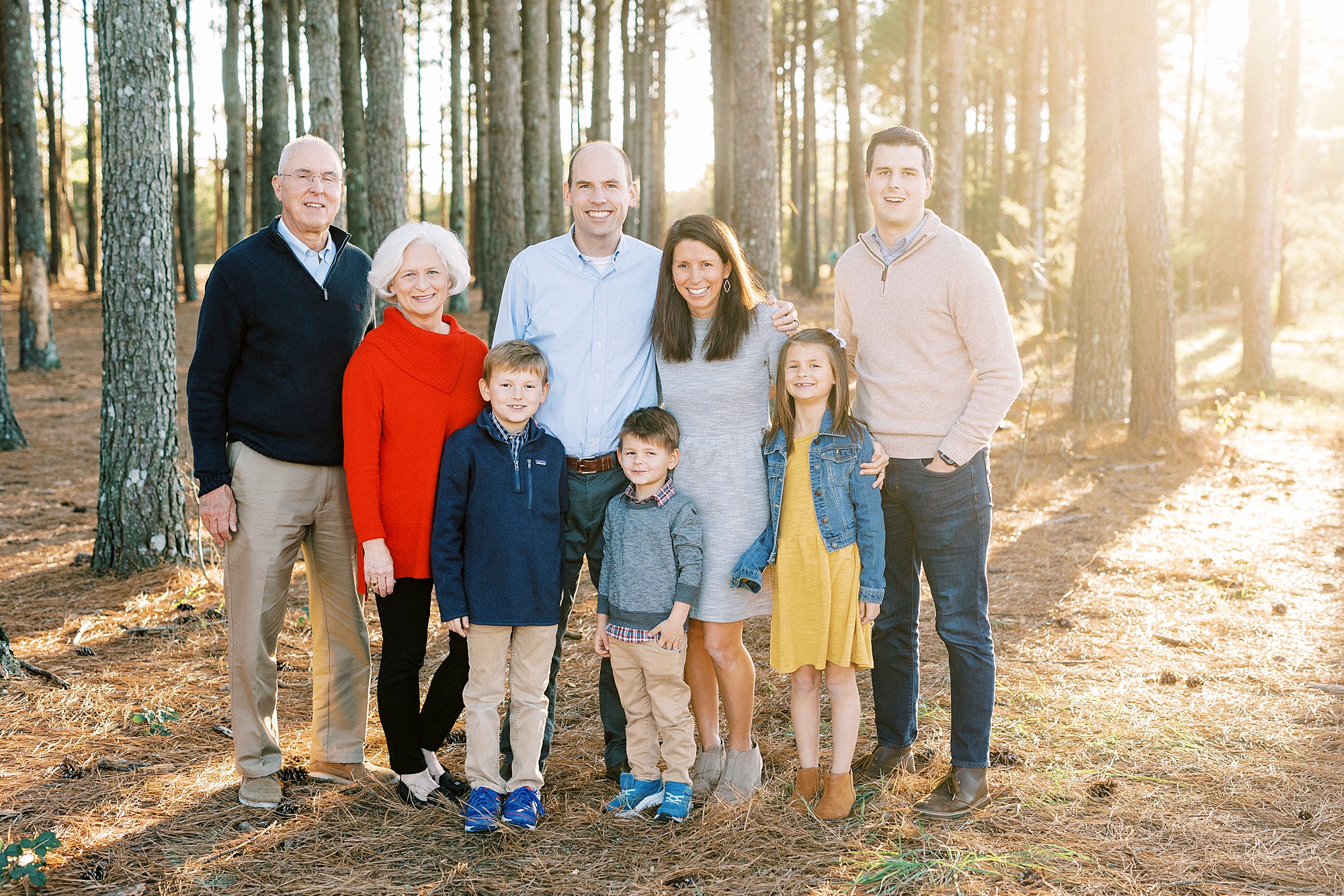 family poses with grandparents during fall family photos at Frank Liske Park