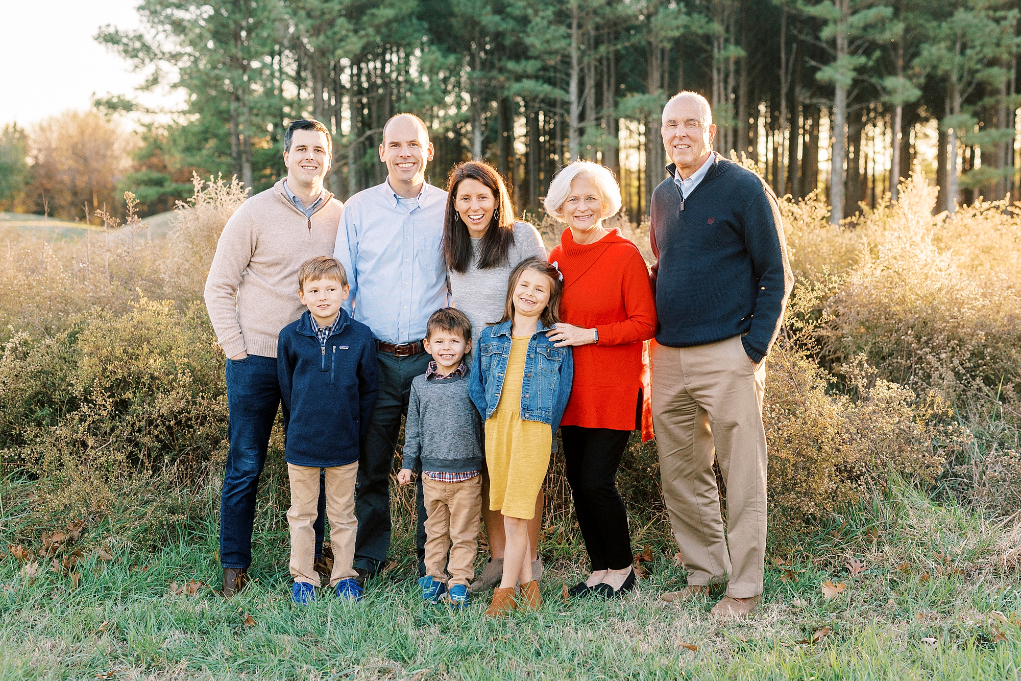 three generations pose together in field at Frank Liske Park