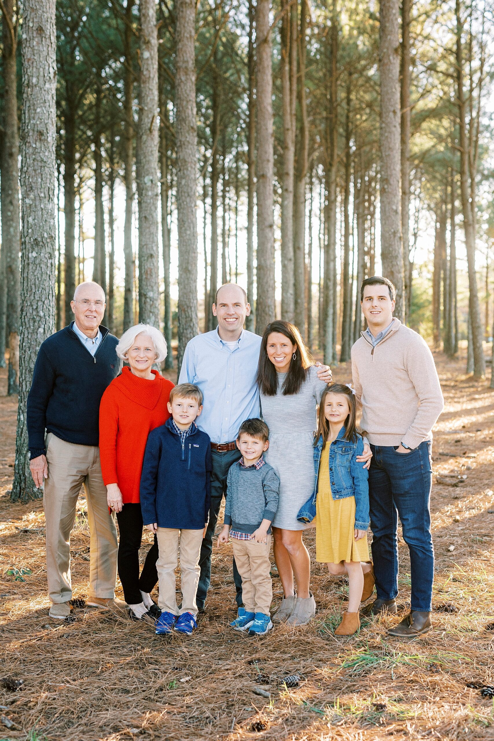 three generations pose together during fall family portraits at Frank Liske Park