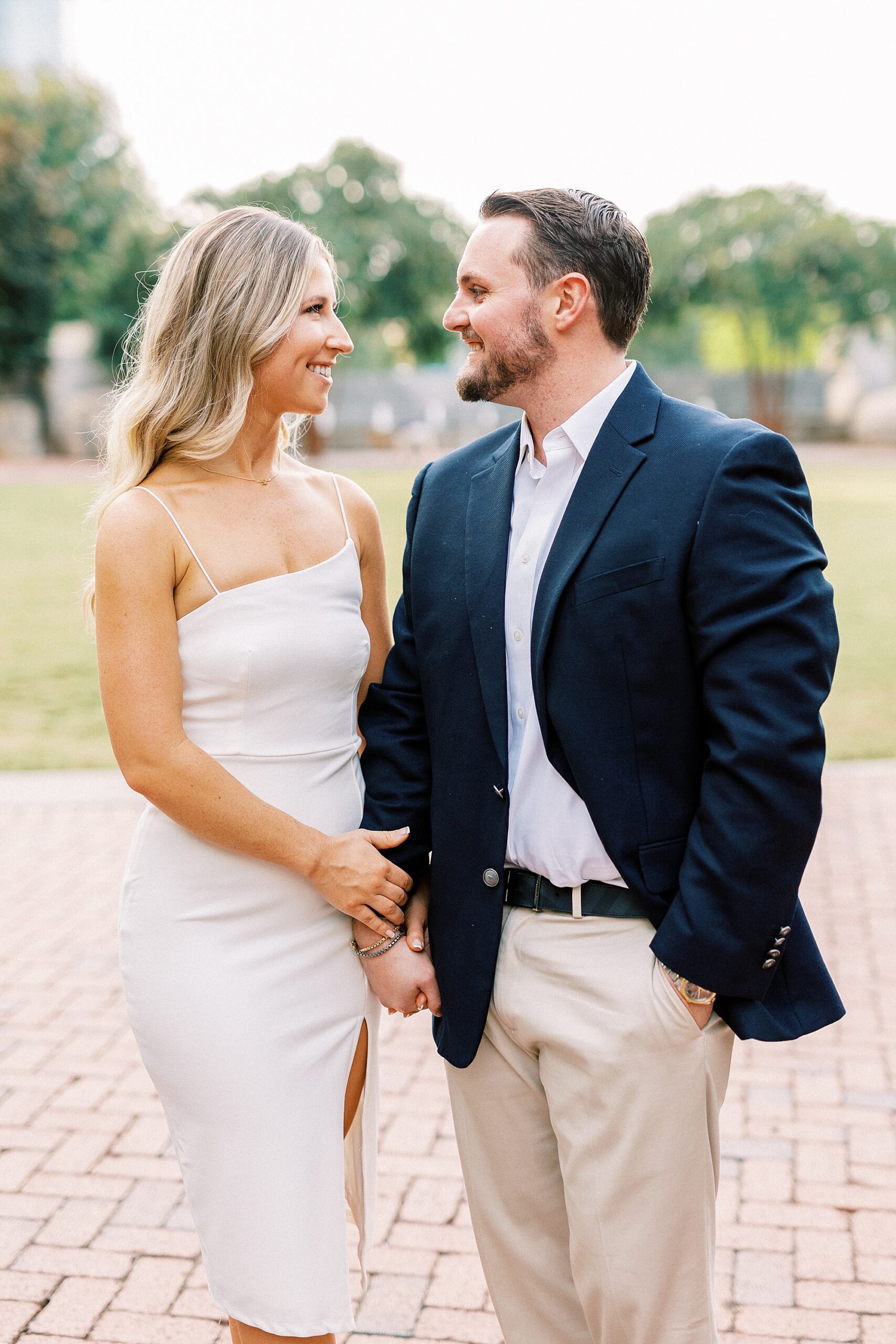 couple holds hands during Romare Bearden Park engagement session