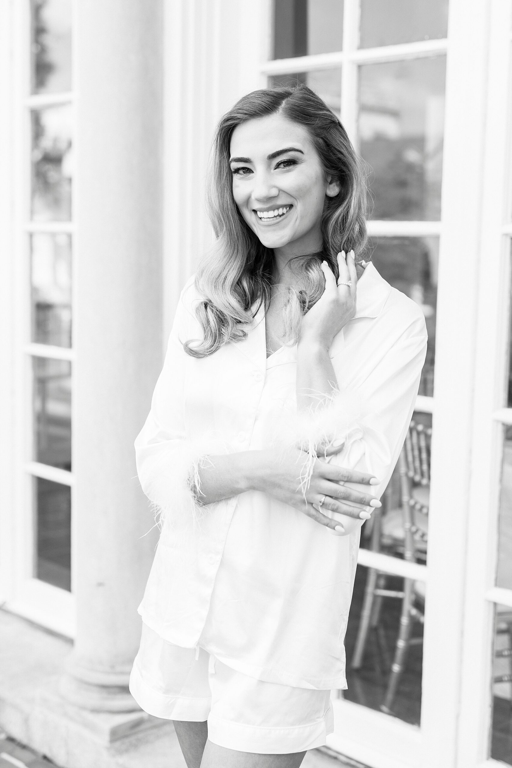 black and white photo of bride outside Separk Mansion in white robe