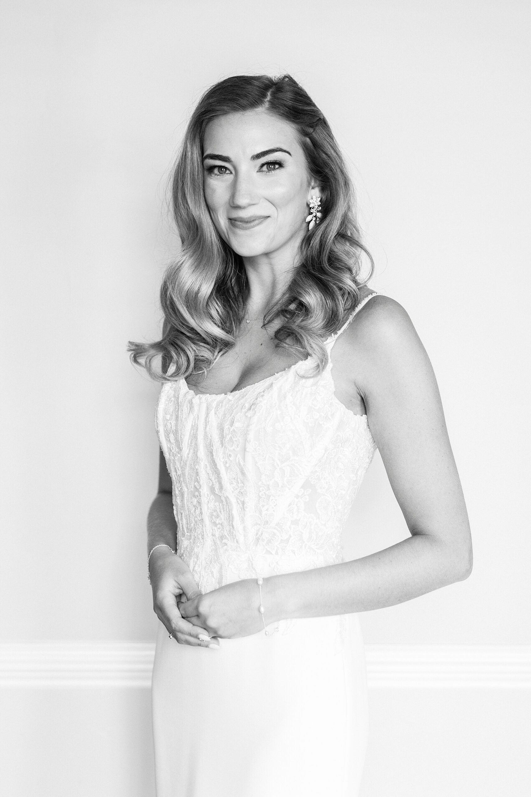 black and white portrait of bride in wedding gown against wall at Separk Mansion