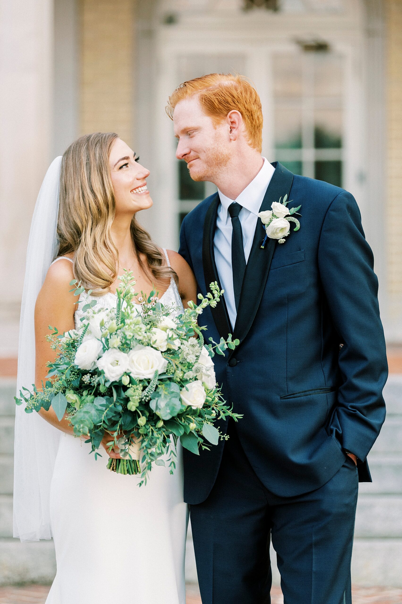 bride and groom hug outside Separk Mansion