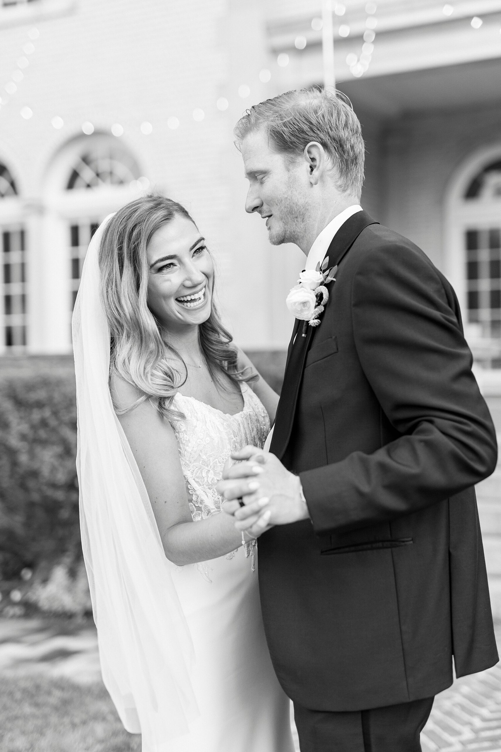 newlyweds dance during portraits outside Separk Mansion