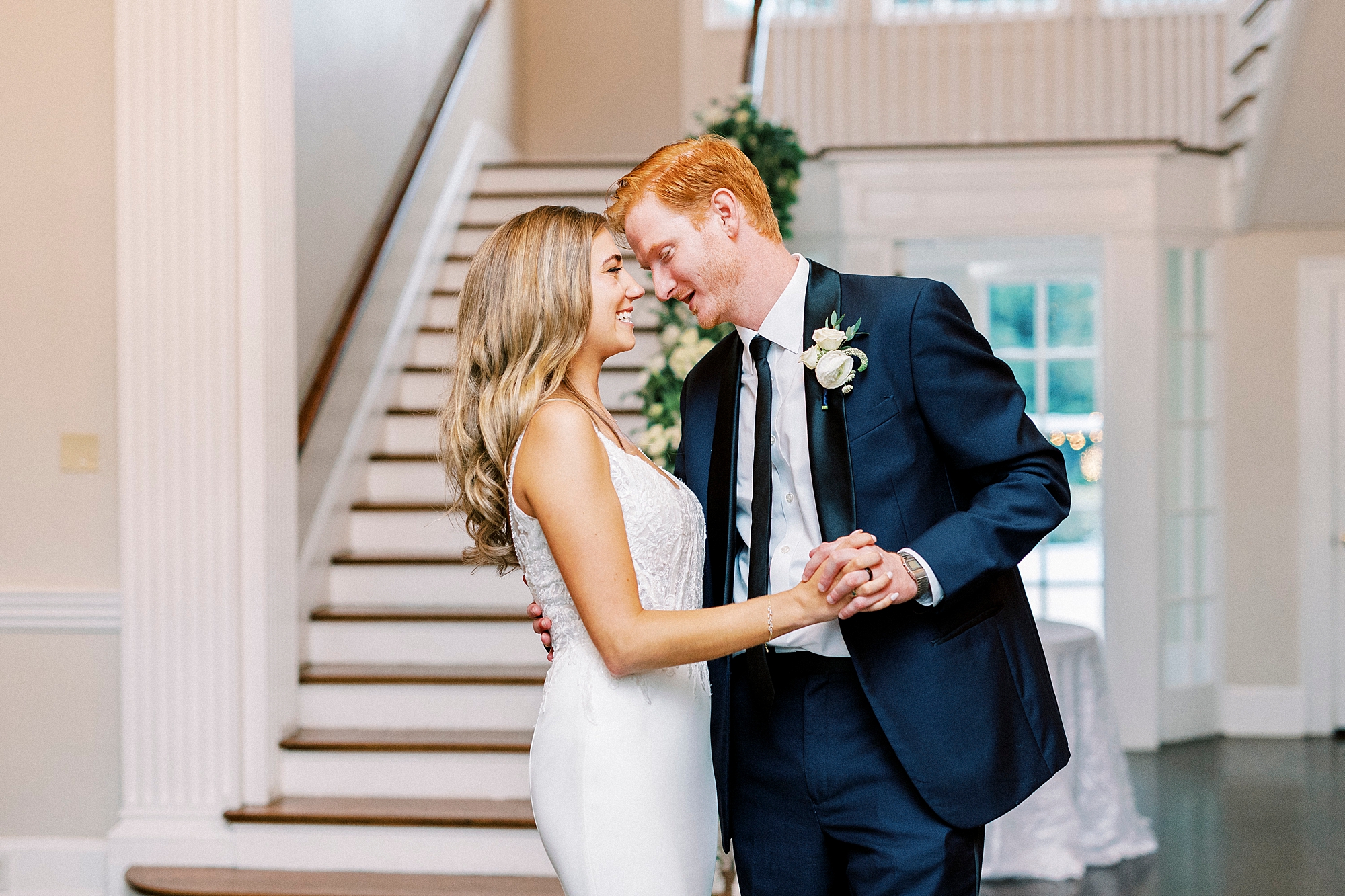 bride and groom lean together during first dance in Separk Mansion