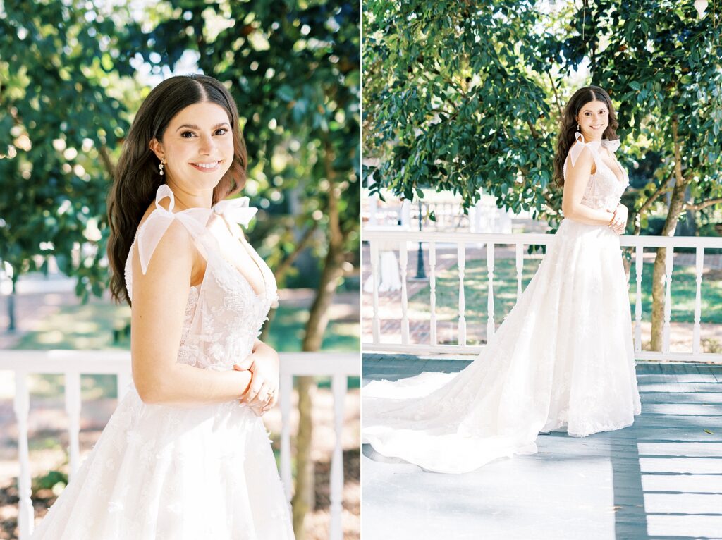 bride poses on front porch in wedding dress with bows on shoulder 