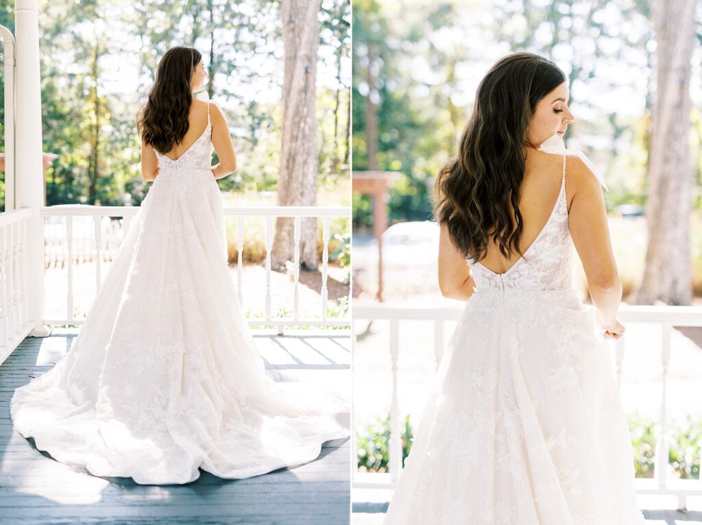 bride smiles looking over shoulder in wedding gown on porch at Whitehead Manor