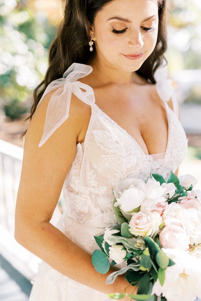 bride holds bouquet of pink and white flowers at Whitehead Manor
