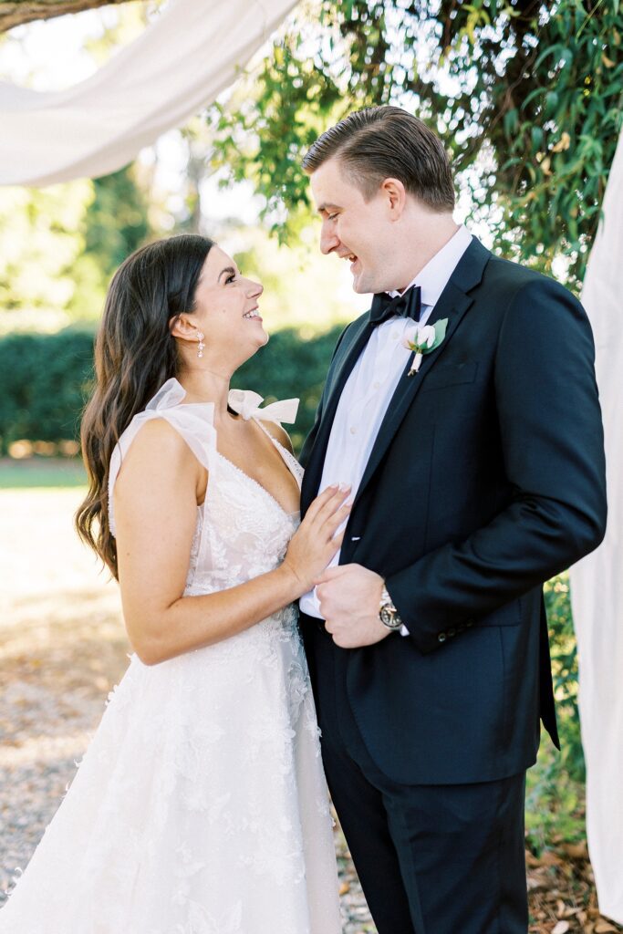 newlyweds smile at each other during fall wedding day at Whitehead Manor