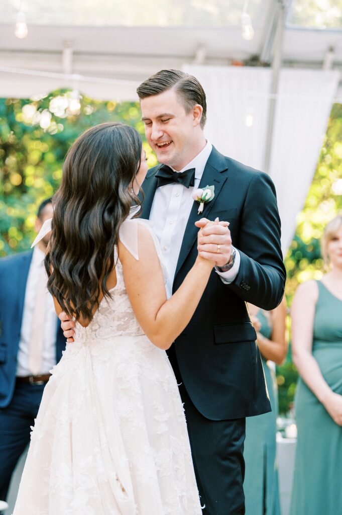 newlyweds dance under clear tent at Whitehead Manor