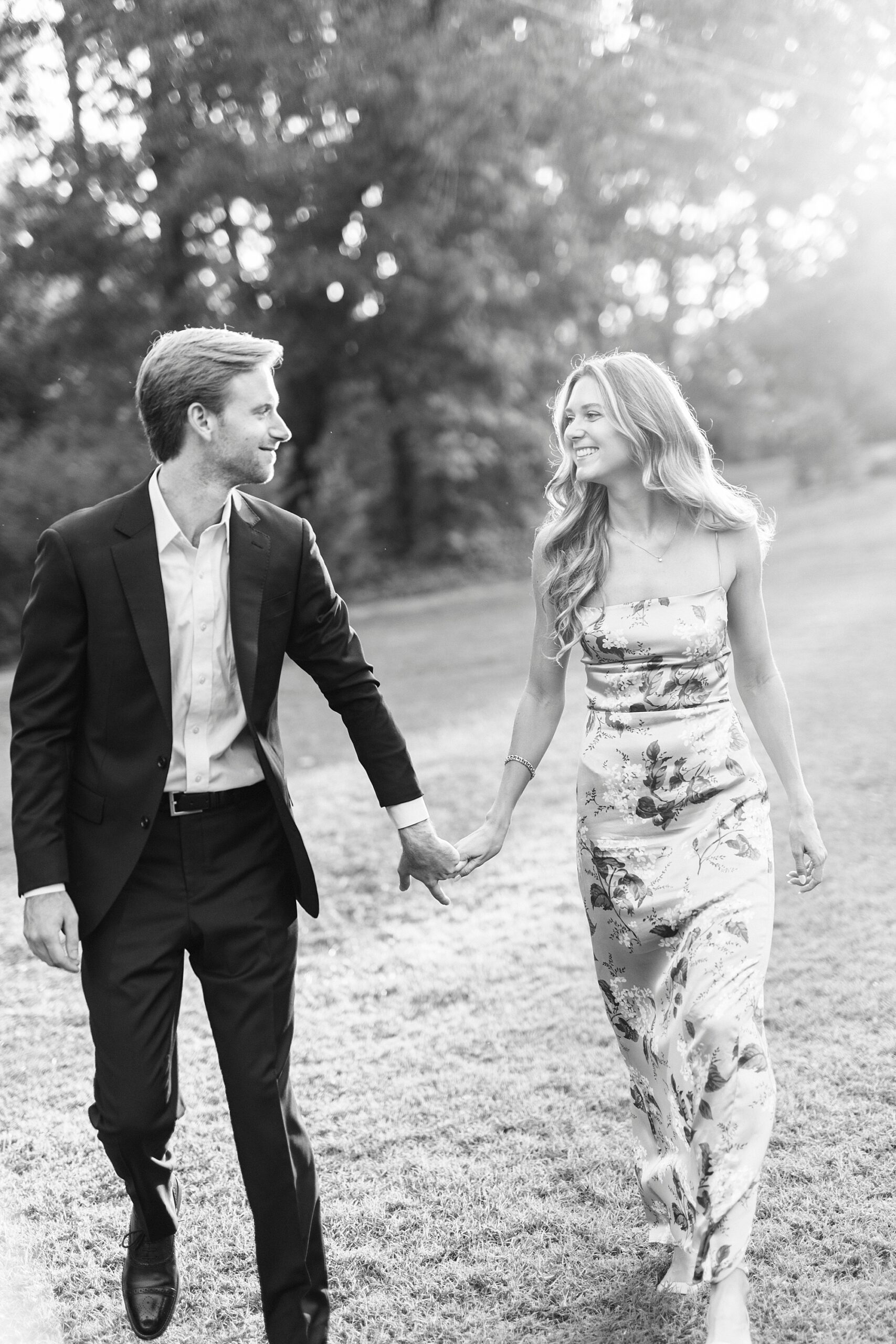 bride and groom hold hands smiling at sunset in Rock Hill SC
