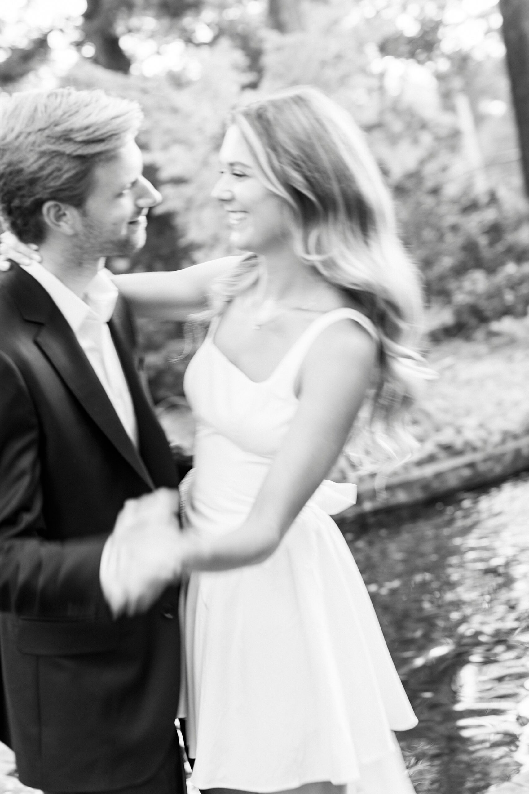 engaged couple dances during Glencairn Garden engagement session in Rock Hill SC