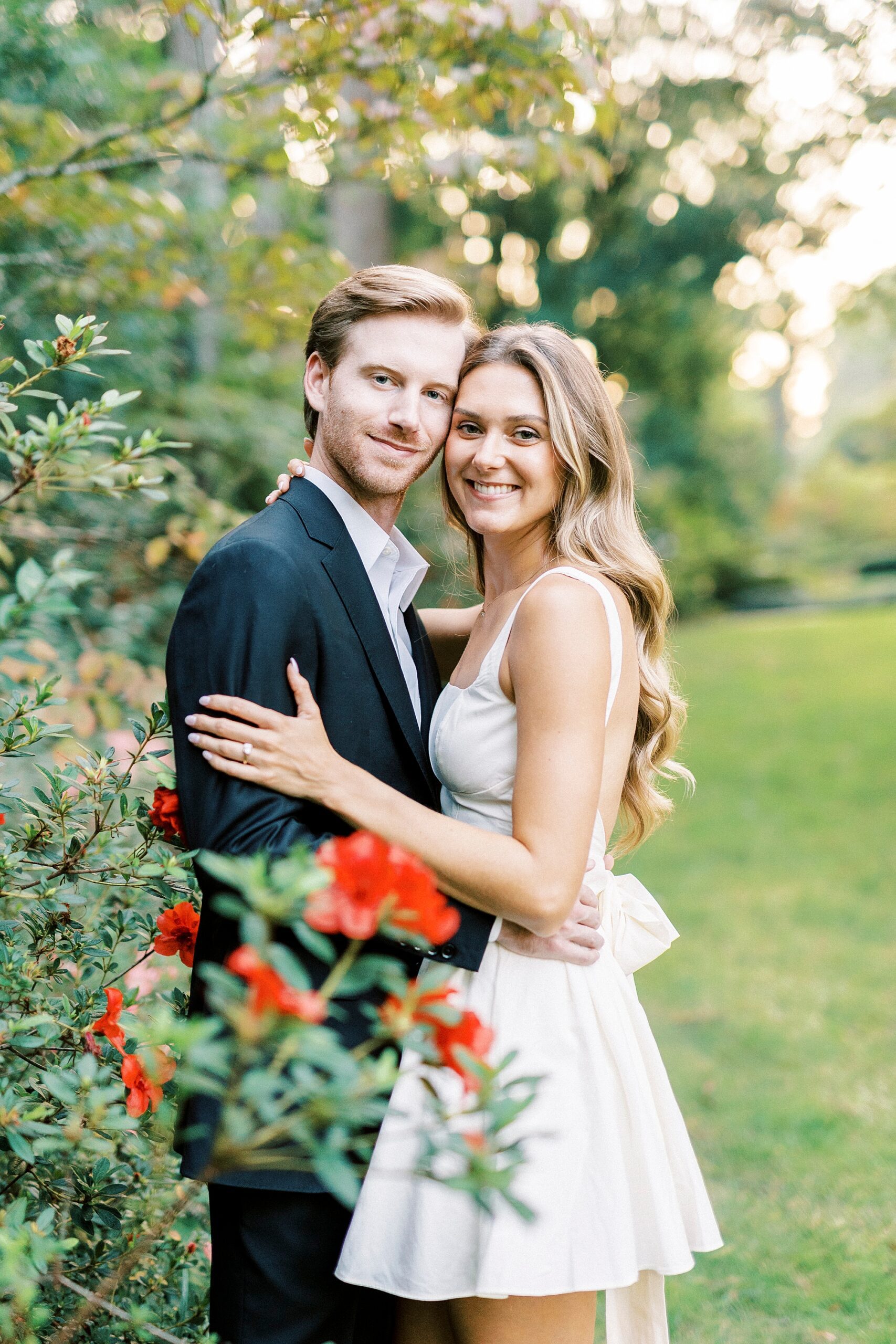 man and woman hug inside Glencairn Garden during Rock Hill SC engagement session