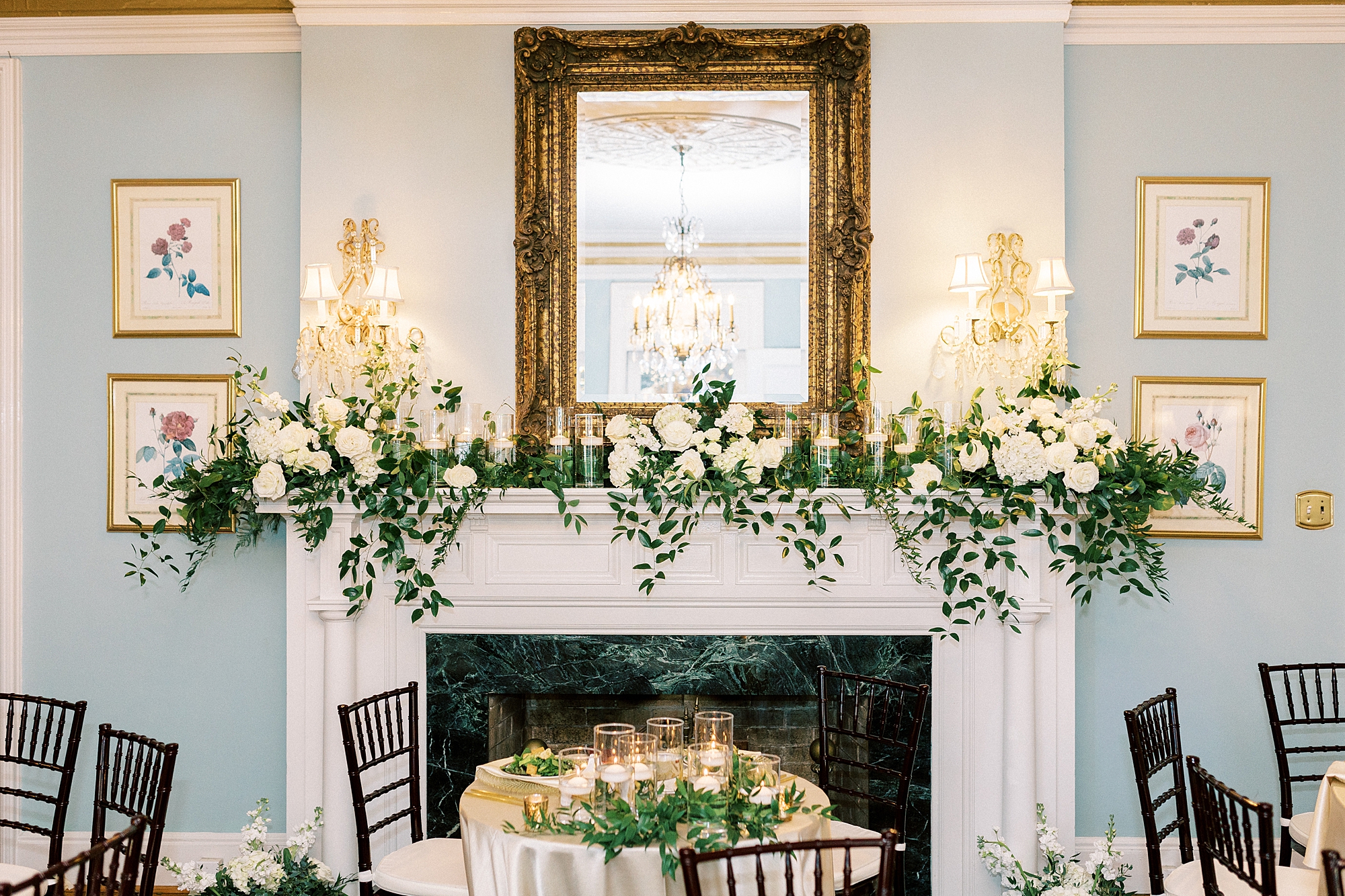 ivory flowers draped on mantle inside the Morehead Inn