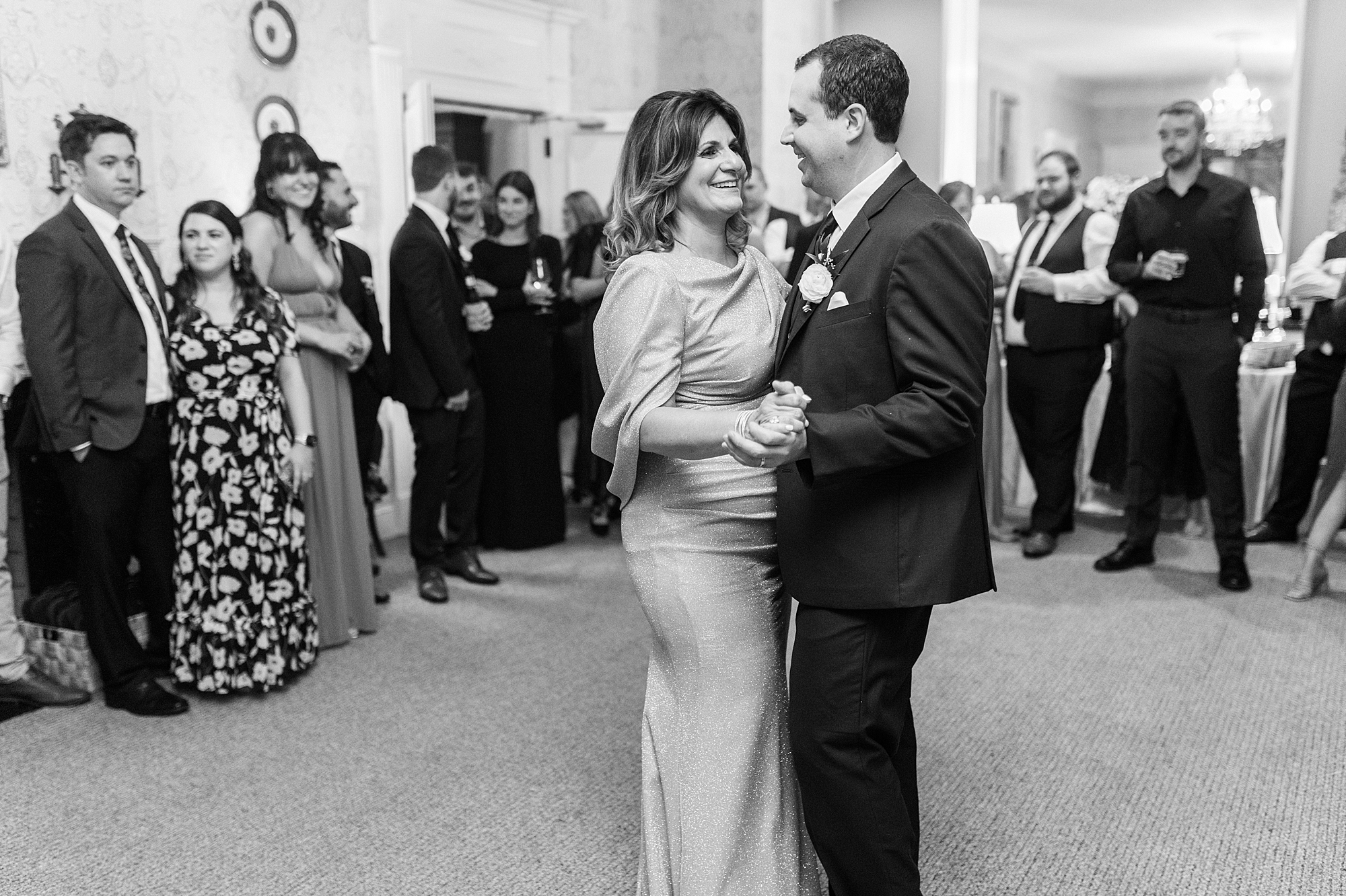 mother dances with groom during NC wedding reception