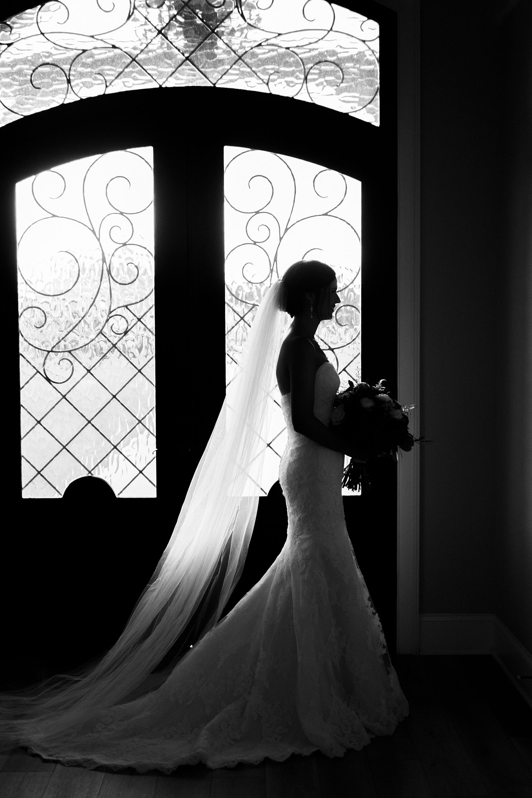 bride walks in front of chapel door at Chickadee Hill Farms