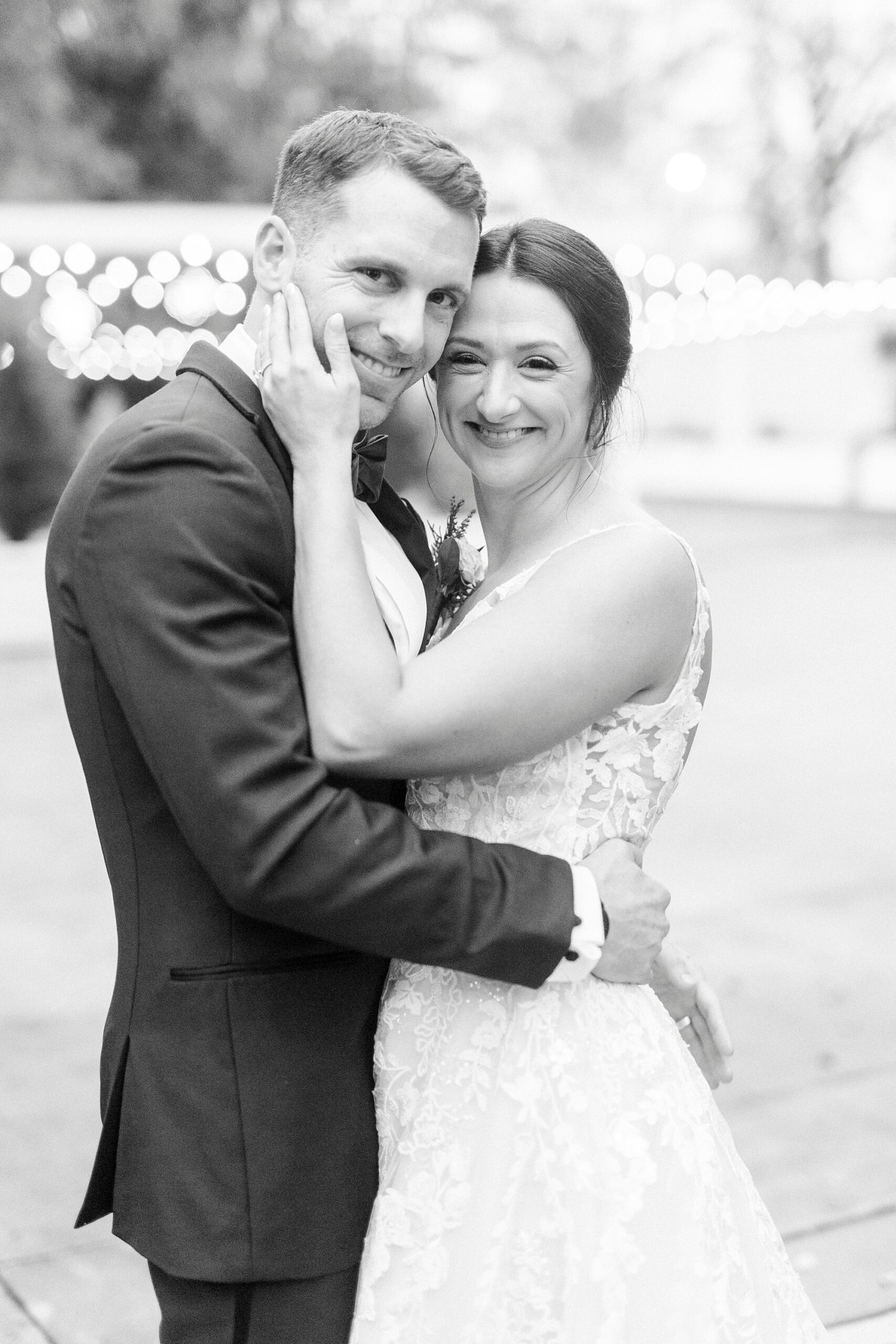 bride and groom hug leaning heads together during winter wedding at Separk Mansion 