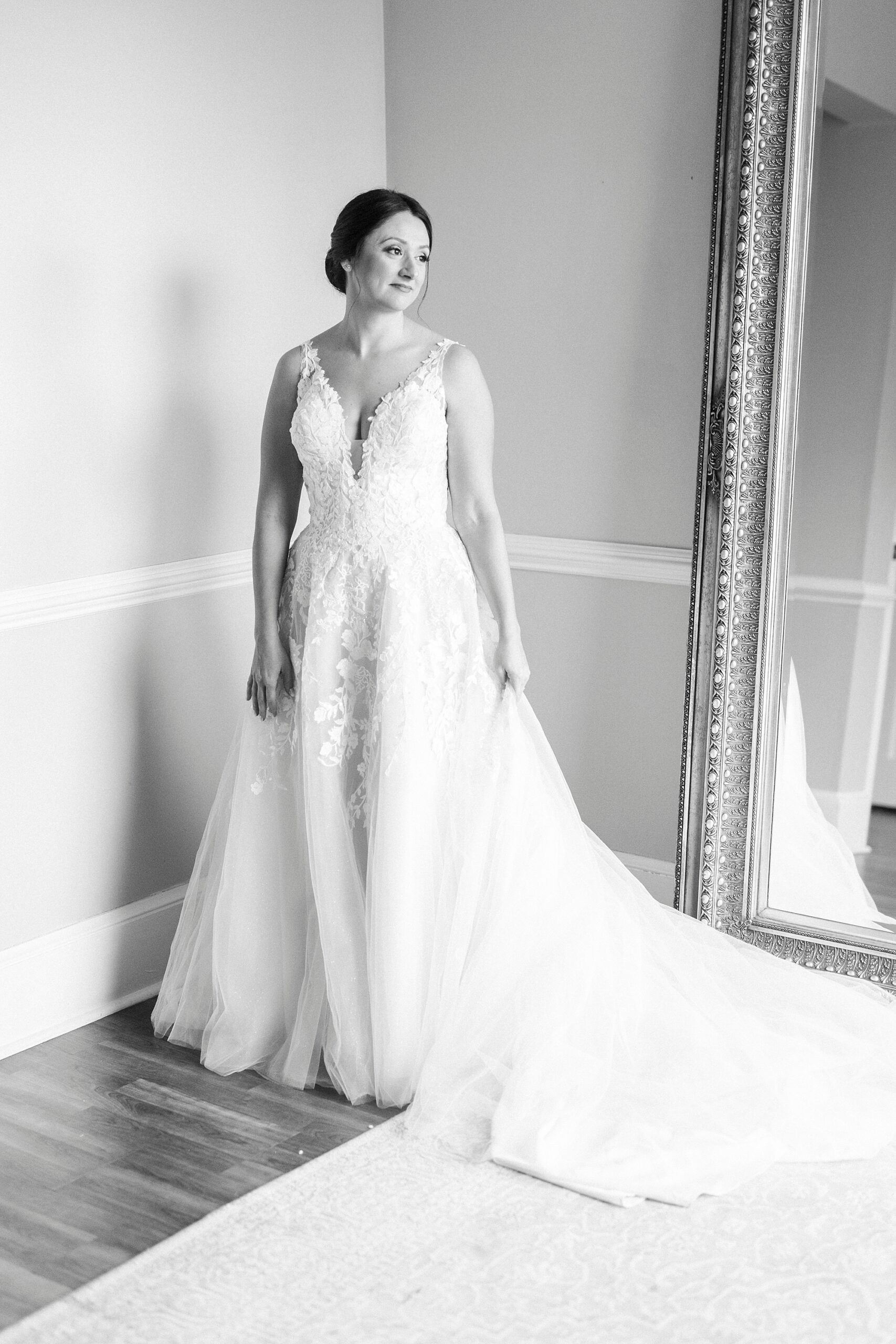 bride stands in corner of bridal suite at Separk Mansion 